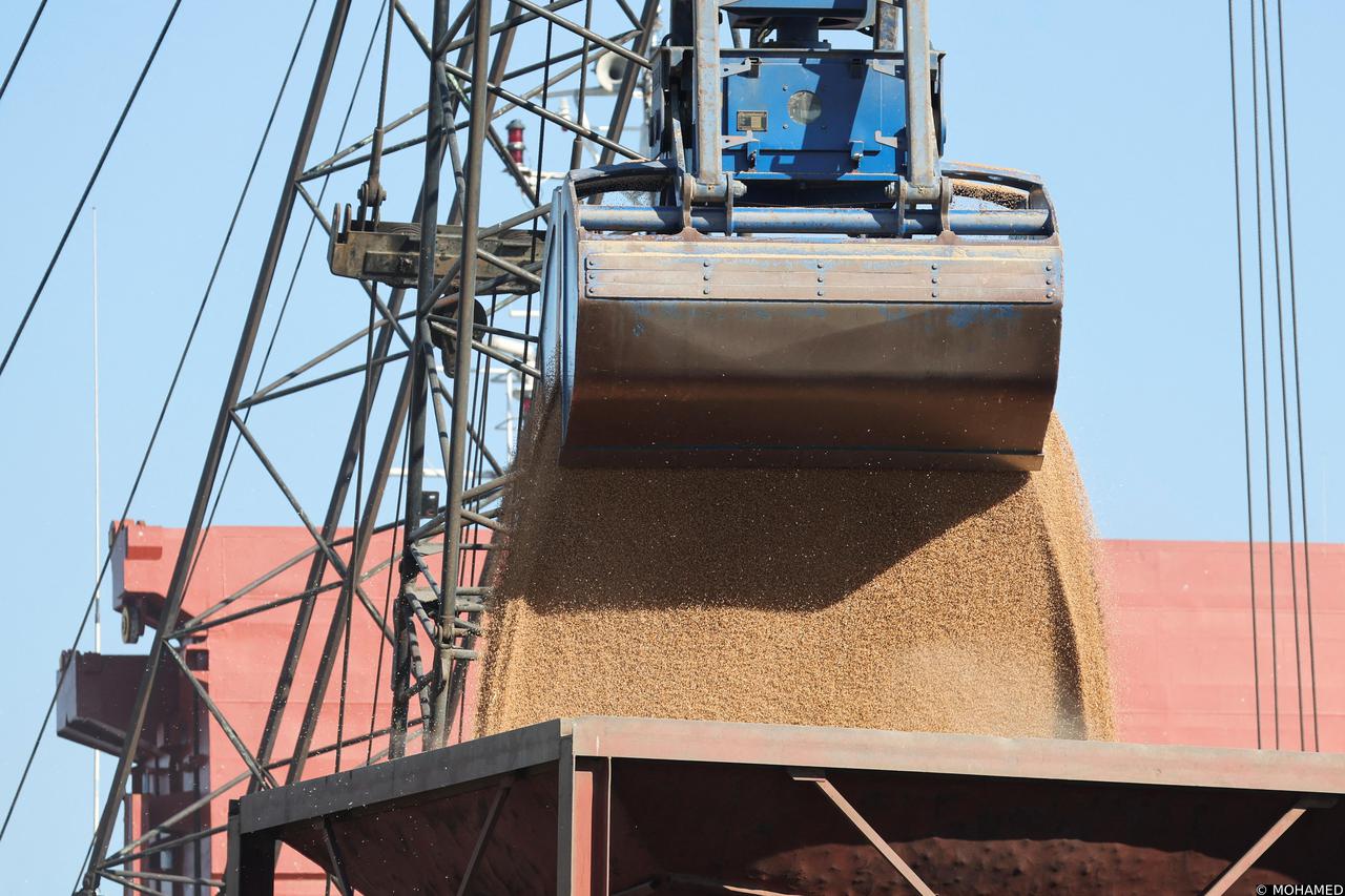 A machinery loads wheat into a truck at Beirut's port