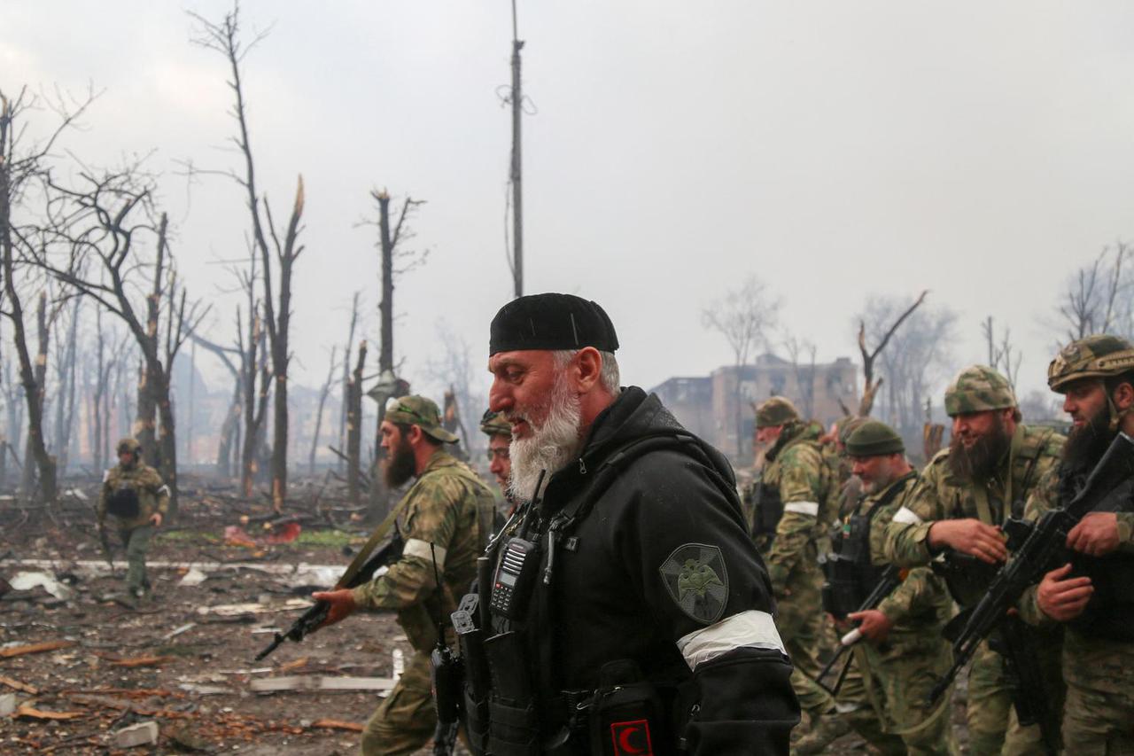 Fighters of the Chechen special forces unit walk in Mariupol