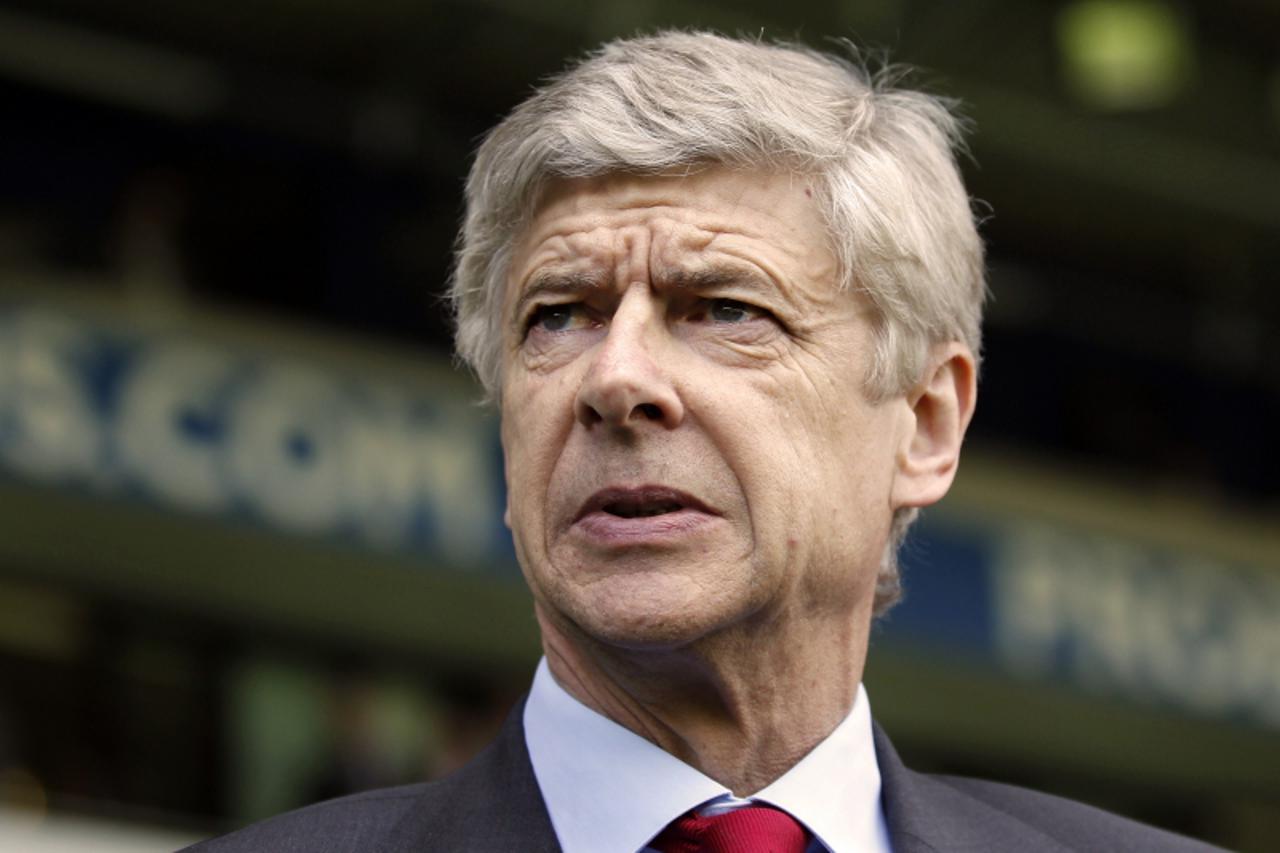 'Arsene Wenger, Manager of Arsenal awaits kick off during the match between West Bromwich Albion and  Arsenal at The Hawthorns in West Bromwich, England on May 13, 2012. AFP PHOTO/IAN KINGTON   RESTRI