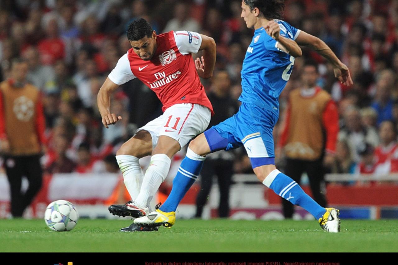 \'Arsenal\'s Andre Santos (left) and Olympiakos\' Lubomir Fejsa (right) in action Photo: Press Association/Pixsell\'