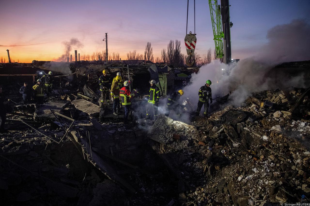 Rescuers work at an area heavily damaged by a Russian missile strike in Mykolaiv