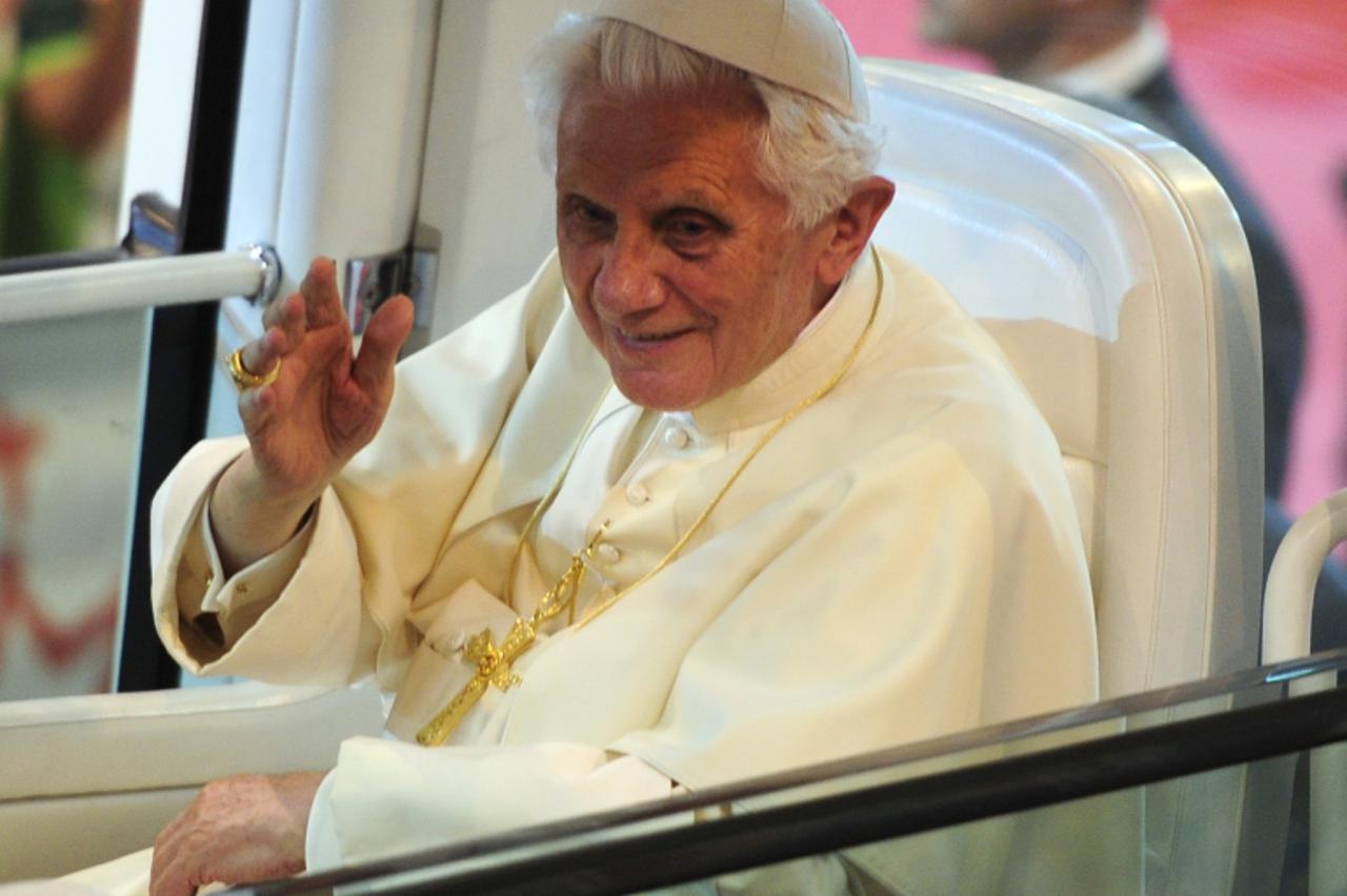 'Pope Benedict XVI bids farewell to volunteers in Madrid on August 21, 2011. Pope Benedict XVI said Spain need not surrender its Catholic soul as he bade farewell Sunday after leading religous festivi