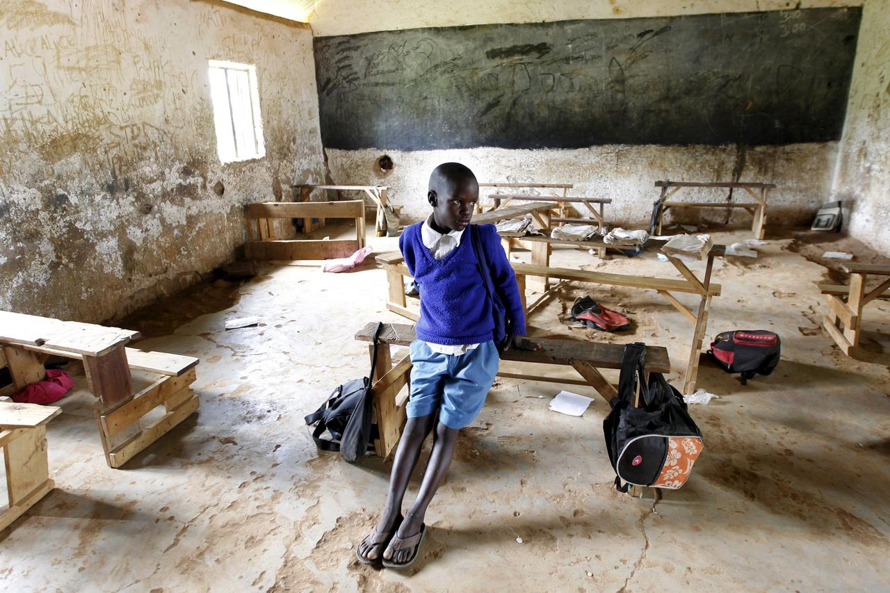 Seven-year-old Barack Obama Okoth, named after U.S. President Barack Obama, sits inside an empty classroom as he speaks with Reuters at the Senator Obama primary school in Nyangoma village in Kogelo, west of Kenya's capital Nairobi, June 23, 2015. When Ba