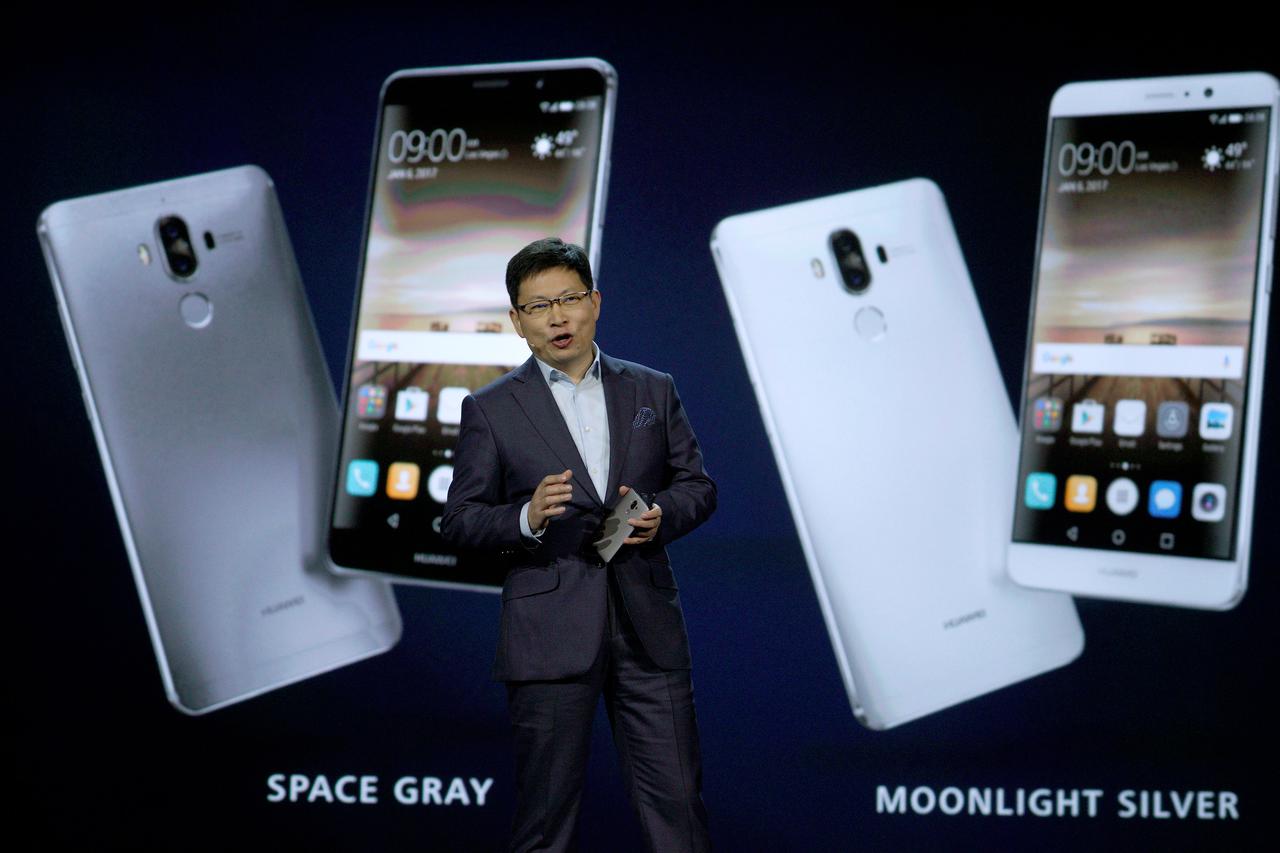 Richard Yu, Huawei CEO Consumer Business Group, talks about their Huawei Mate 9 smartphone just released to the U.S. market and displayed behind him during his keynote address at CES in Las Vegas, January 5, 2017.  REUTERS/Rick Wilking