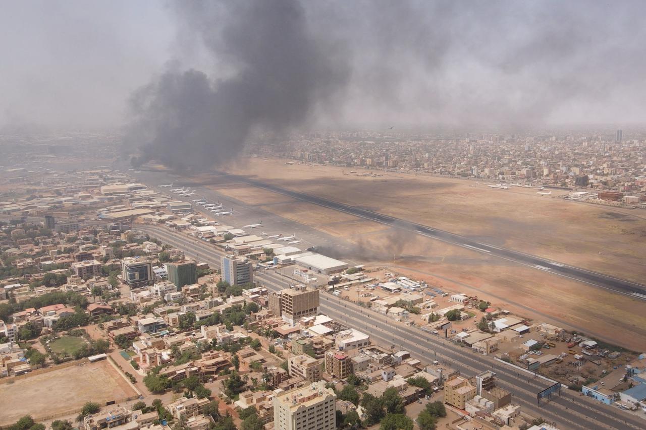 FILE PHOTO: Smoke rises over the city as army and paramilitaries clash in power struggle, in Khartoum