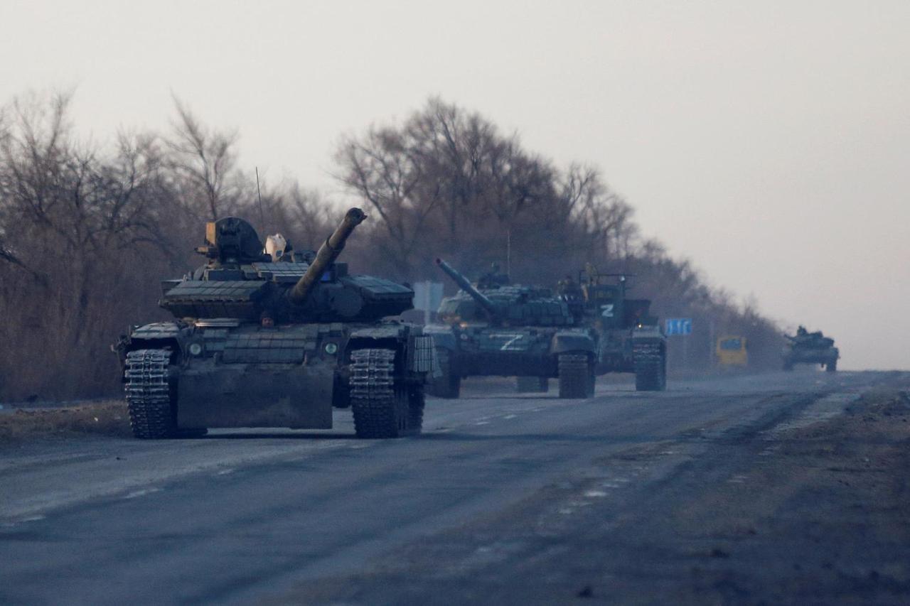 Service members of pro-Russian troops are seen near the besieged city of Mariupol