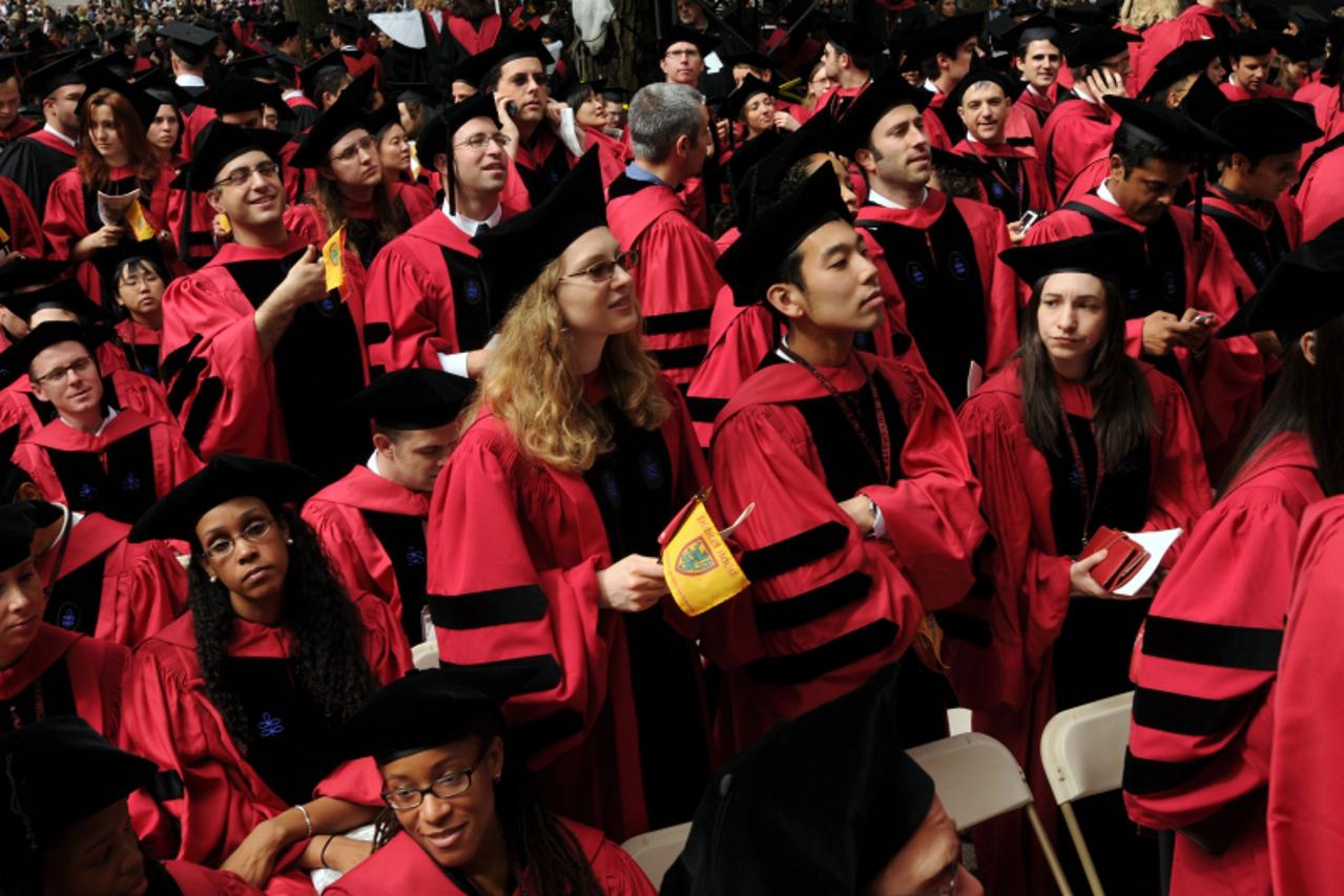 'CAMBRIDGE, MA - JUNE 4: Harvard University students attend commencement ceremonies June 4, 2009 in Harvard Yard in Cambridge, Massachusetts. Founded in 1636, this year marks the 358th year of graduat