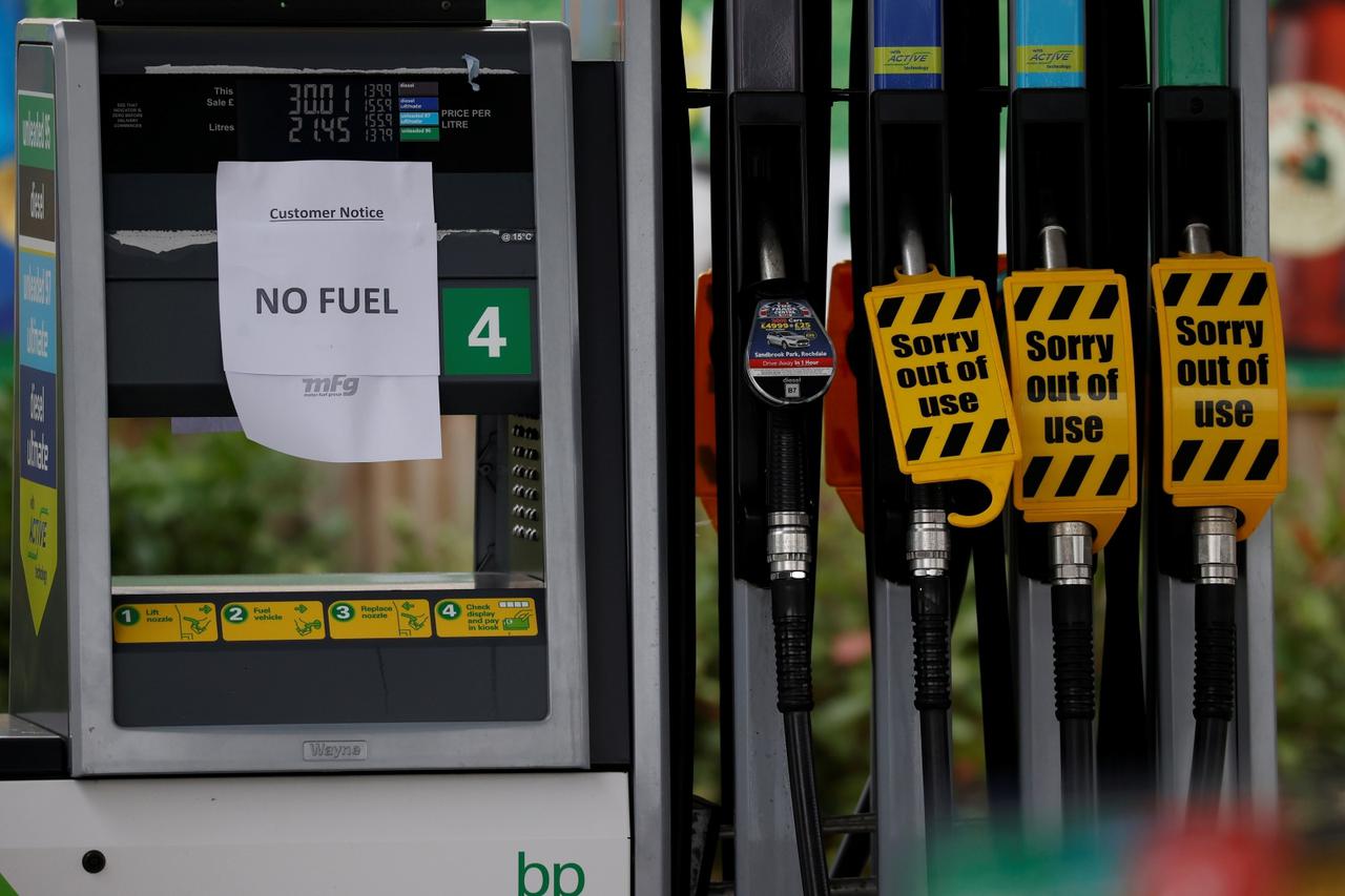 A 'No Fuel' sign is attached to an empty petrol pump at a BP filling station in Manchester