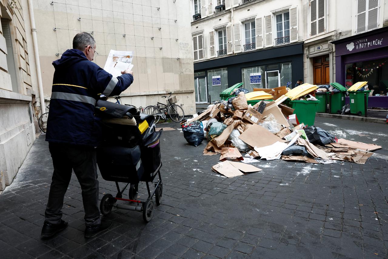 Garbage piles up as strikes continue over pension reform in Paris