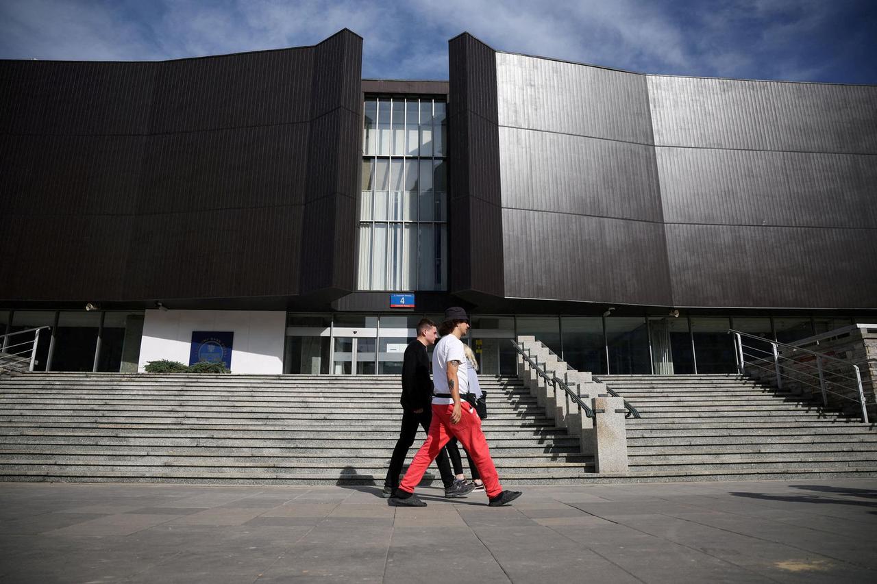 FILE PHOTO: People walk in front of the Polish Central Bank (NBP) building in Warsaw