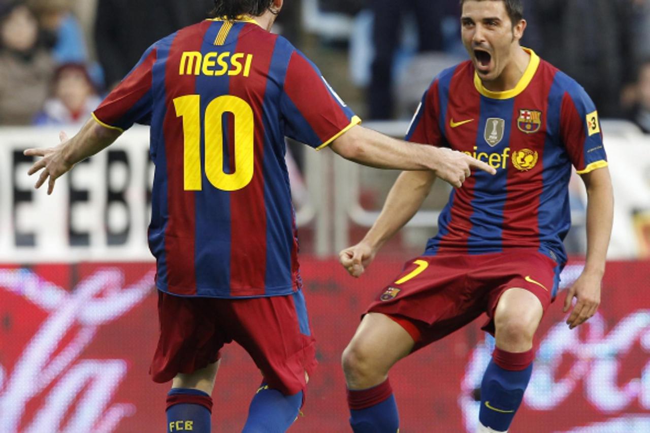 'Barcelona\'s Lionel Messi (L) and David Villa (R) celebrate a goal against Zaragoza during their Spanish first division soccer match at La Romareda stadium in Zaragoza, October 23, 2010. REUTERS/Albe