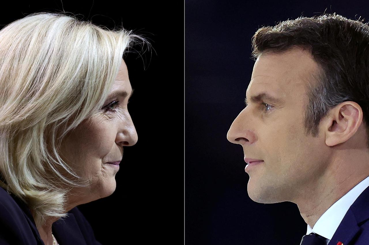 A combination picture shows portraits of Le Pen and Macron running for the second round of the 2022 French Presidential election