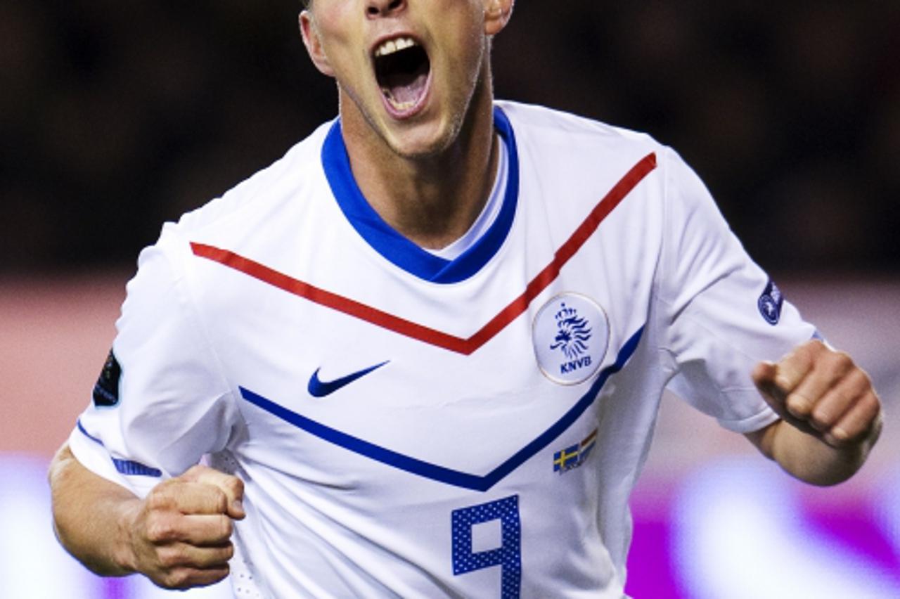 \'Klaas Jan Huntelaar of the Netherlands celebrate as he scores against Sweden during their Euro 2012 Group E qualifying match between at the Rasunda stadium in Stockholm on October 11, 2011,AFP PHOTO