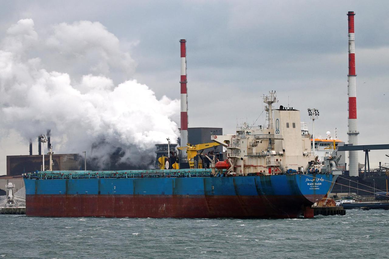 FILE PHOTO: A cargo ship is moored in the French harbor of Dunkerque
