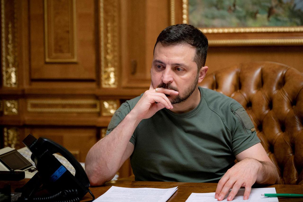 FILE PHOTO: Ukraine's President Zelenskiy is seen during a phone call with U.S. President Biden, in Kyiv