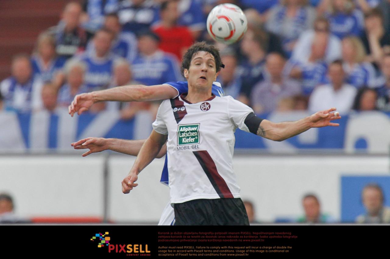 \'23.04.2011, Veltins Arena, Gelsenkirchen, GER, 1.FBL, FC Schalke 04 vs 1. FC Kaiserslautern, im Bild Srdjan Lakic (Kaiserslautern CRO #9) vs Christoph Metzelder (Schalke GER #21), Foto Ÿ nph / Schol