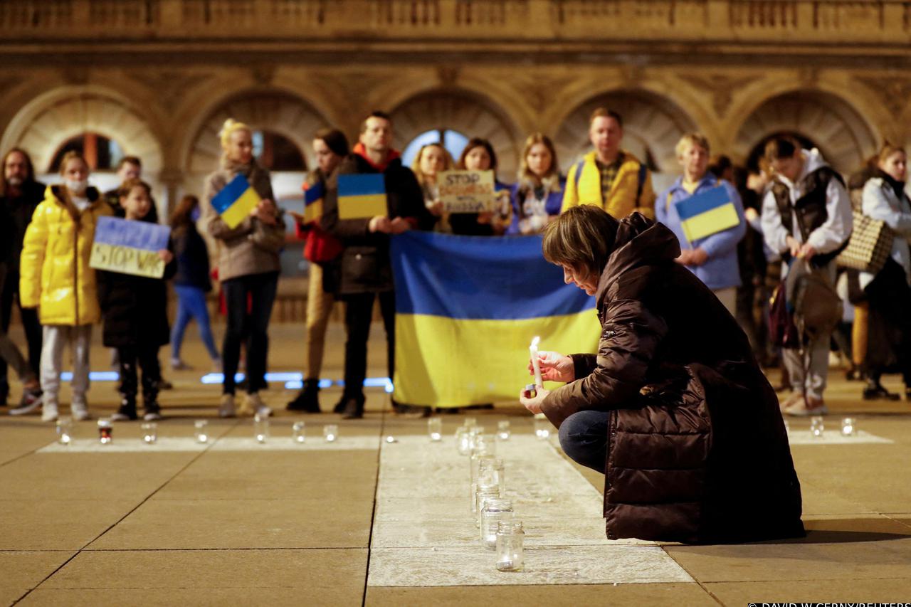 People light candles during a rally against Russia's invasion of Ukraine in Prague