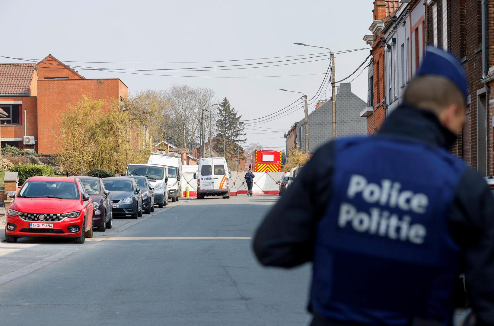 Police officers patrol at the site where a vehicle drove into a group of Belgian carnival performers who were preparing for a parade in the village of Strepy-Bracquegnies, Belgium March 20, 2022. REUTERS/Johanna Geron Photo: JOHANNA GERON/REUTERS