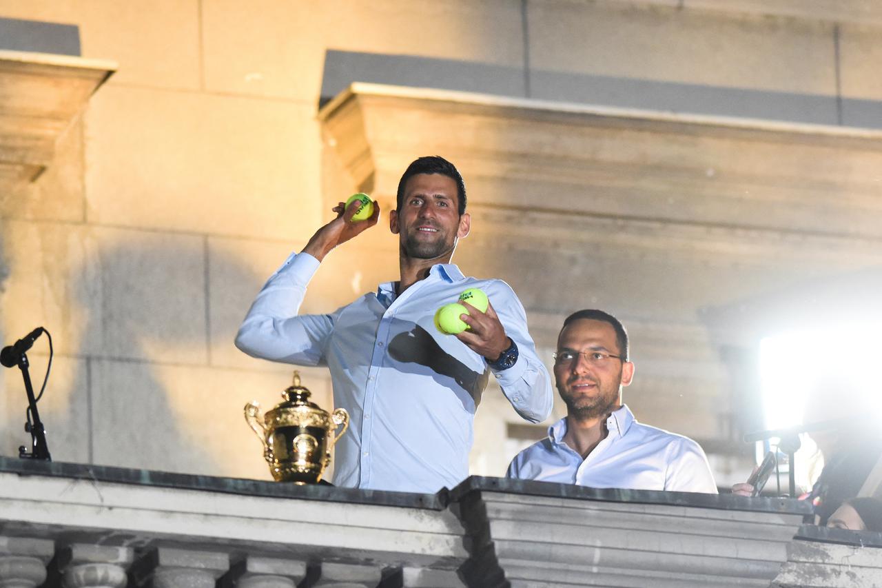Novak Djokovic celebrates winning his seventh Wimbledon title