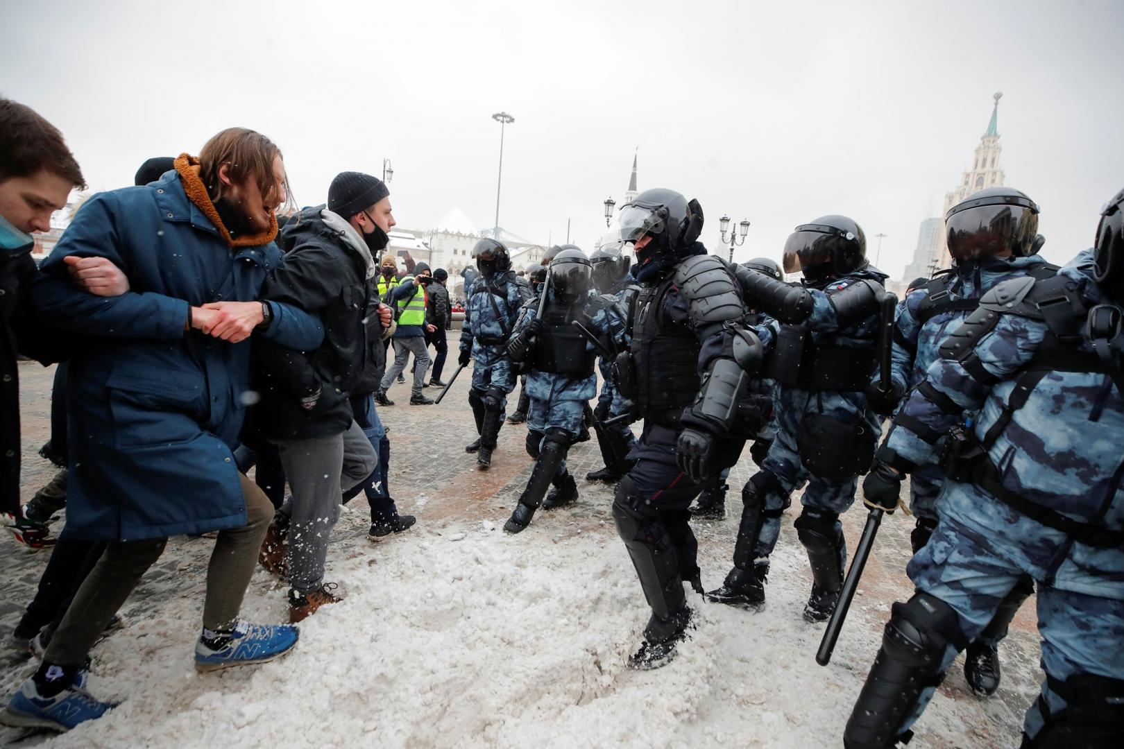 Rally in support of Alexei Navalny in Moscow People are seen in front of law enforcement officers during a rally in support of jailed Russian opposition leader Alexei Navalny in Moscow, Russia January 31, 2021. REUTERS/Maxim Shemetov MAXIM SHEMETOV
