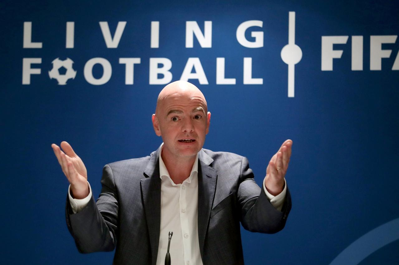 FILE PHOTO: FIFA's President Infantino gestures during a panel discussion in Zurich