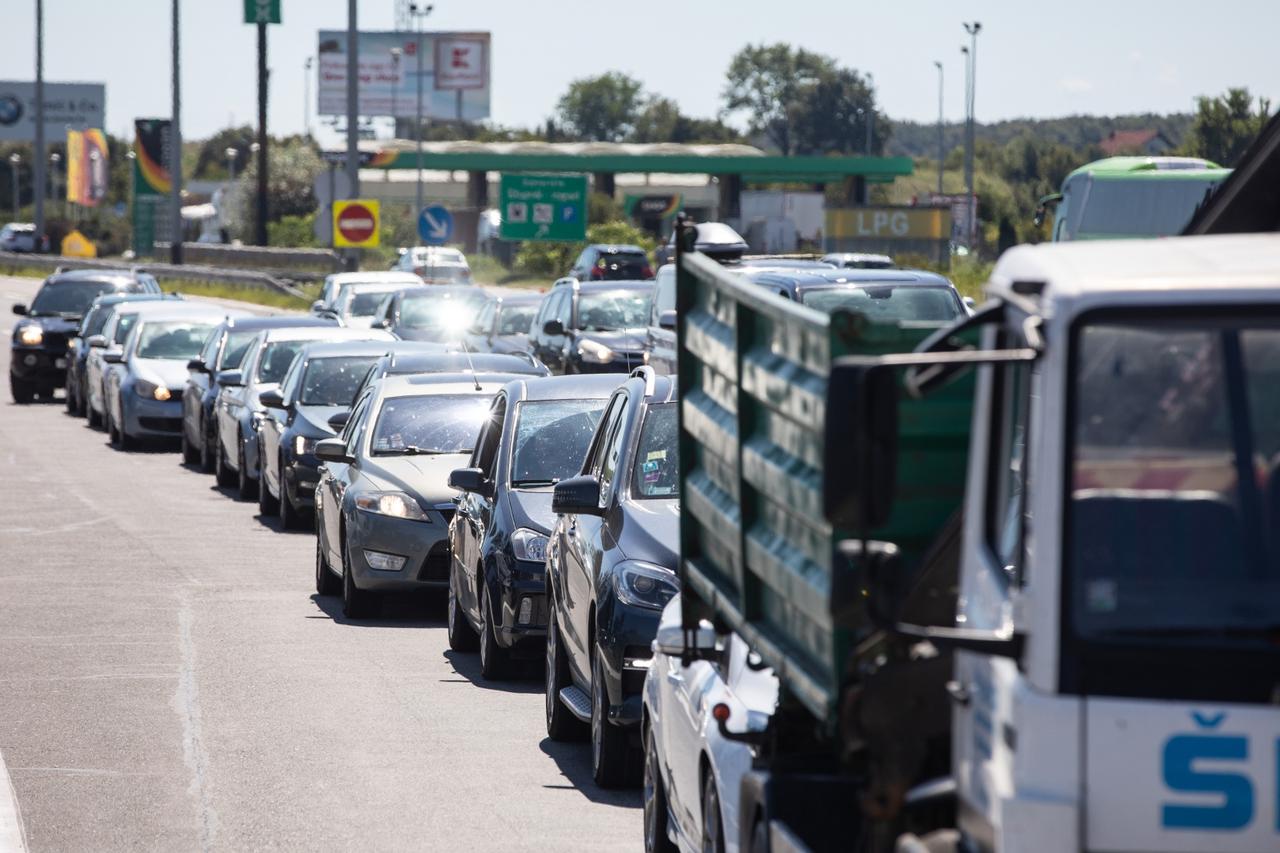 A member of aircrew is seen wearing a protective  face mask at Heathrow Airport, as Britain launches its 14-day quarantine for international arrivals, following the outbreak of the coronavirus disease (COVID-19), London, Britain