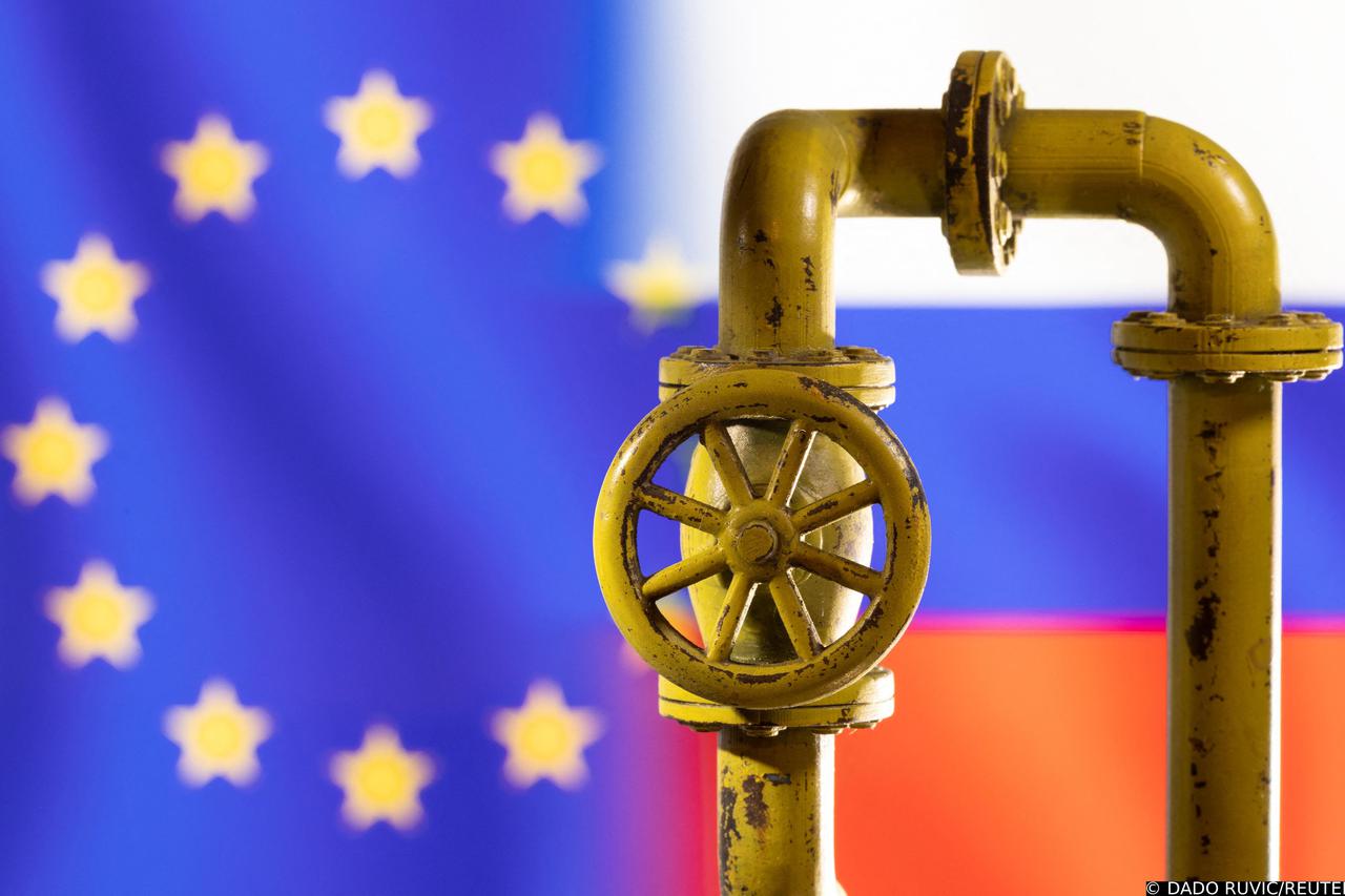 Illustration shows natural gas pipeline in front of word EU and Russia flag colours
