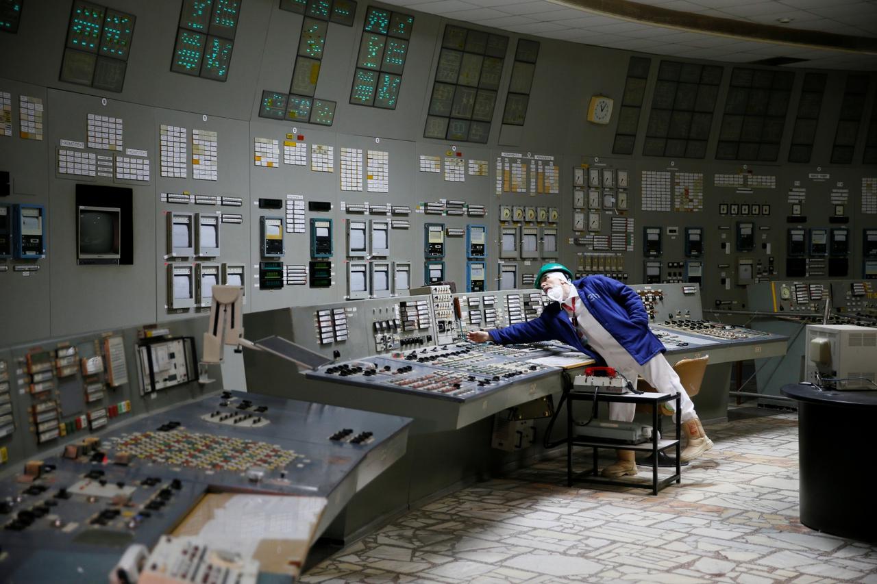 An employee is seen in a control centre of the stopped third reactor at the Chernobyl Nuclear Power Plant