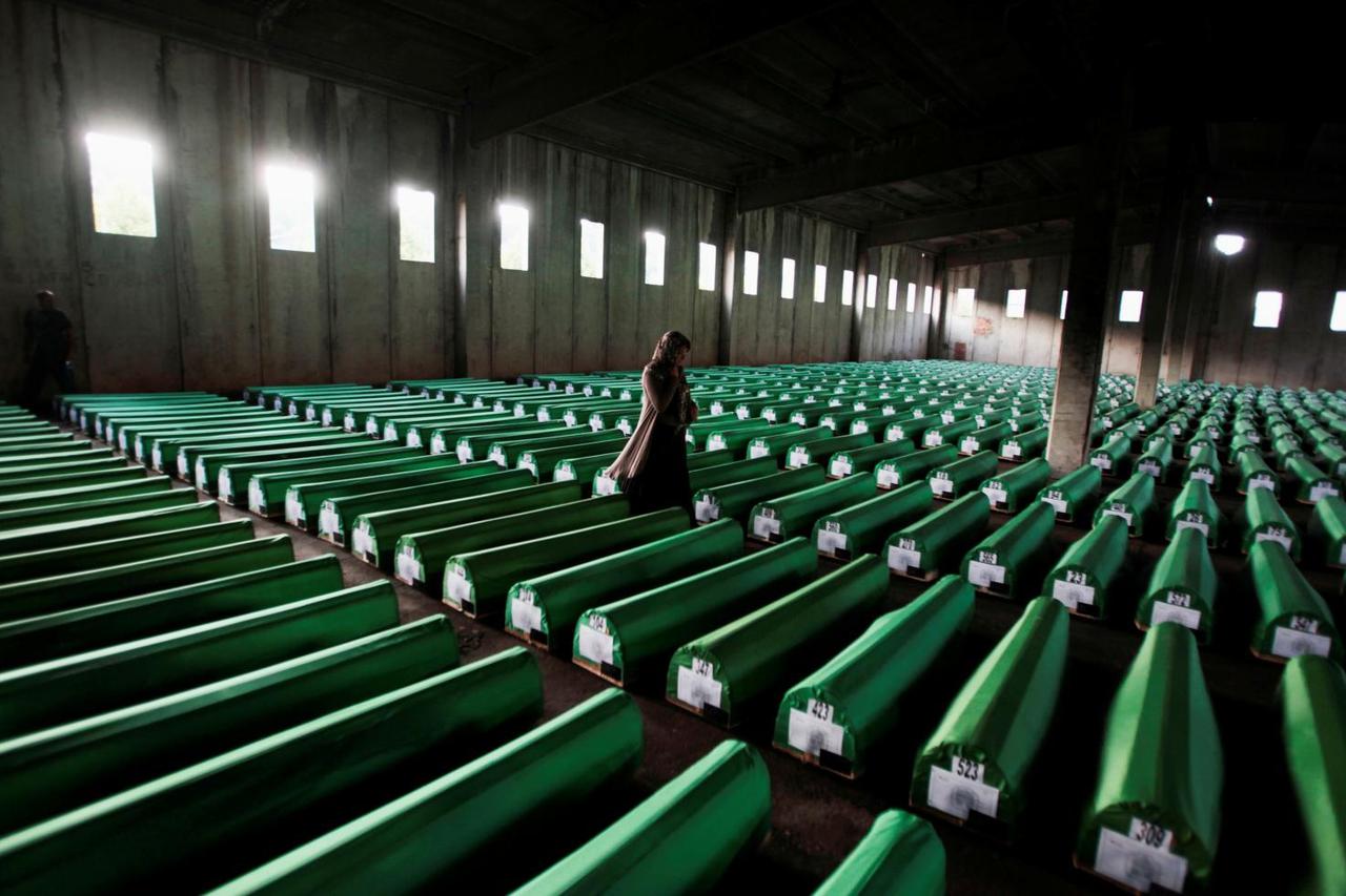 FILE PHOTO: Bosnian Muslim woman searches coffins in Potocari