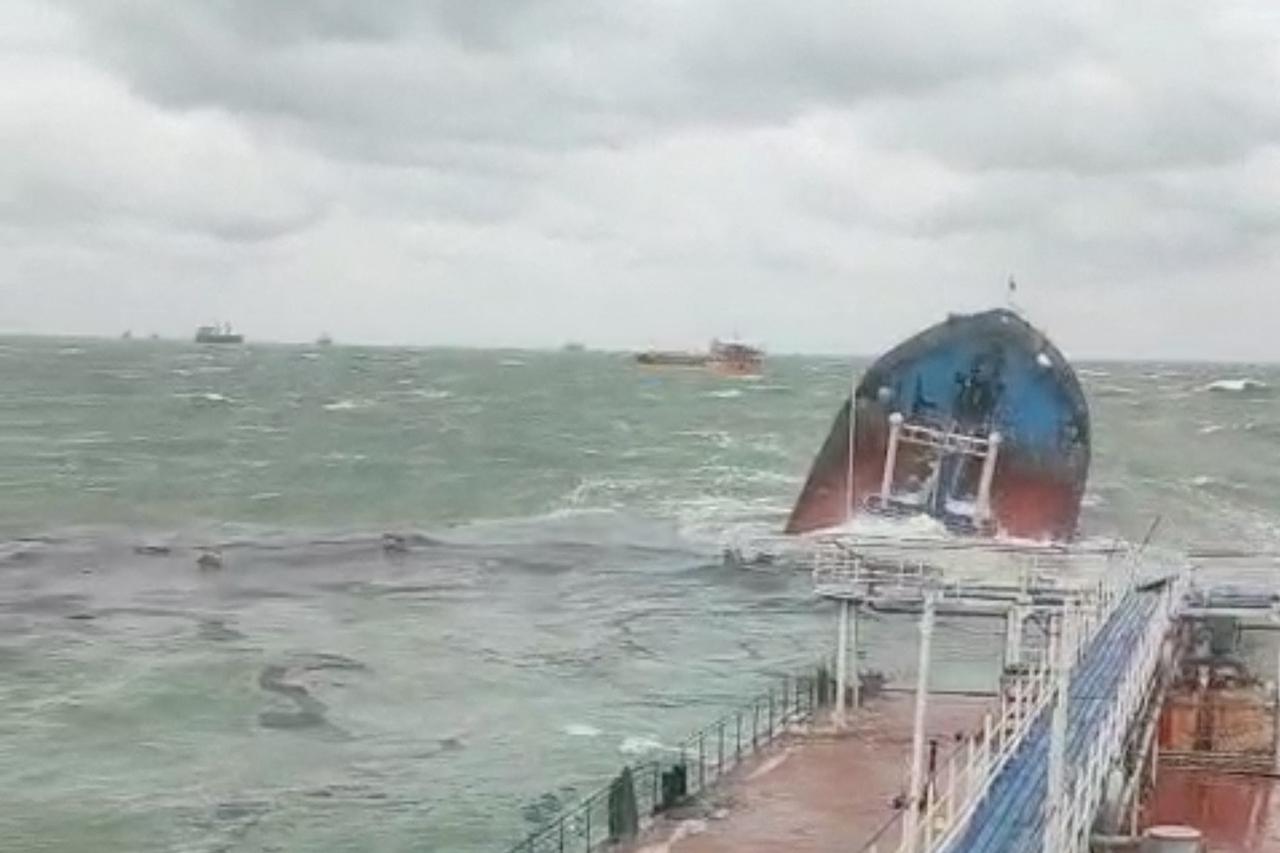 A view from the Volgoneft 239 oil tanker shows the sinking part of the vessel, whose damage caused an oil spill, in the Kerch Strait