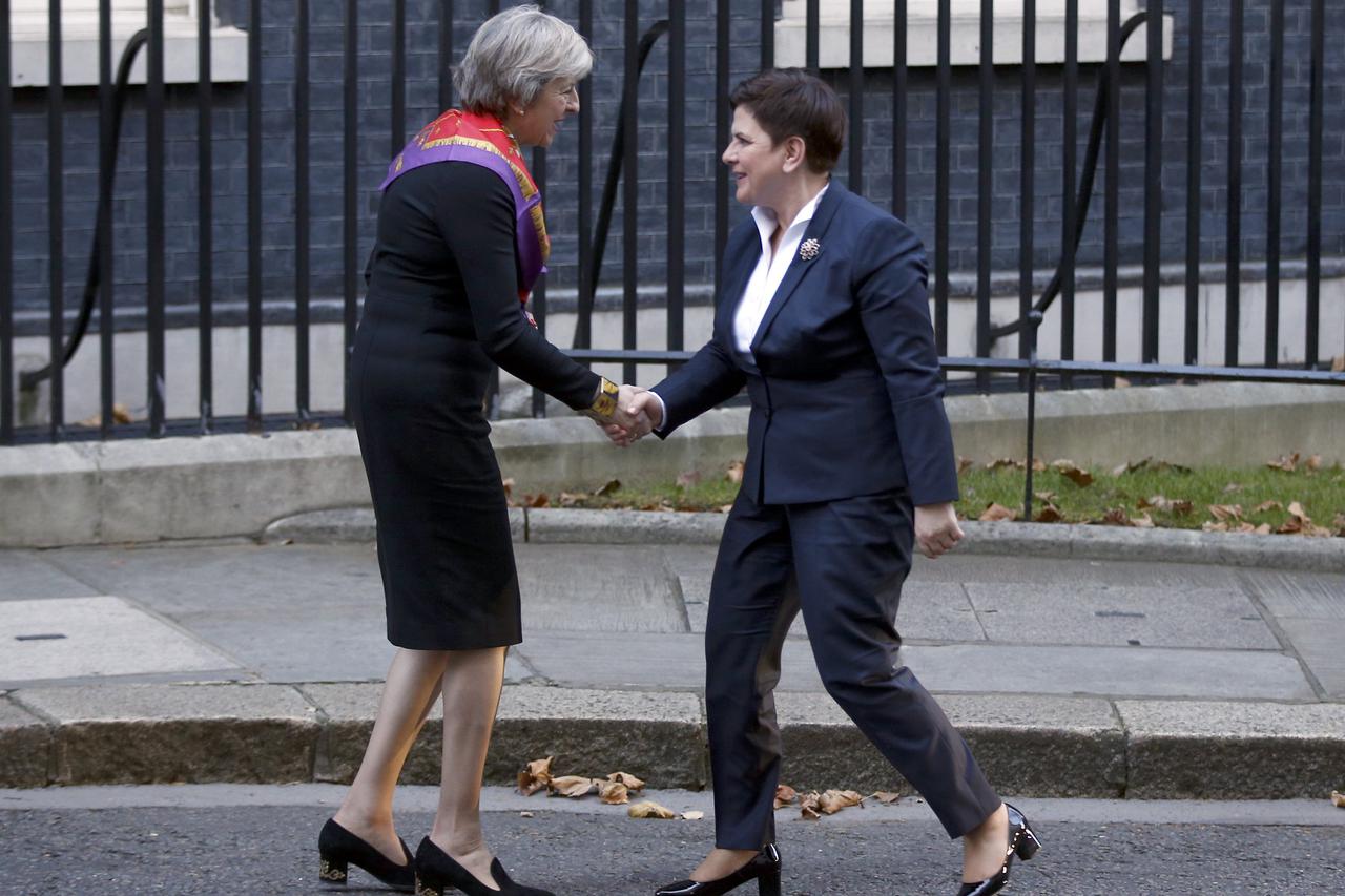 Theresa May greets her Polish counterpart Beata Szydlo