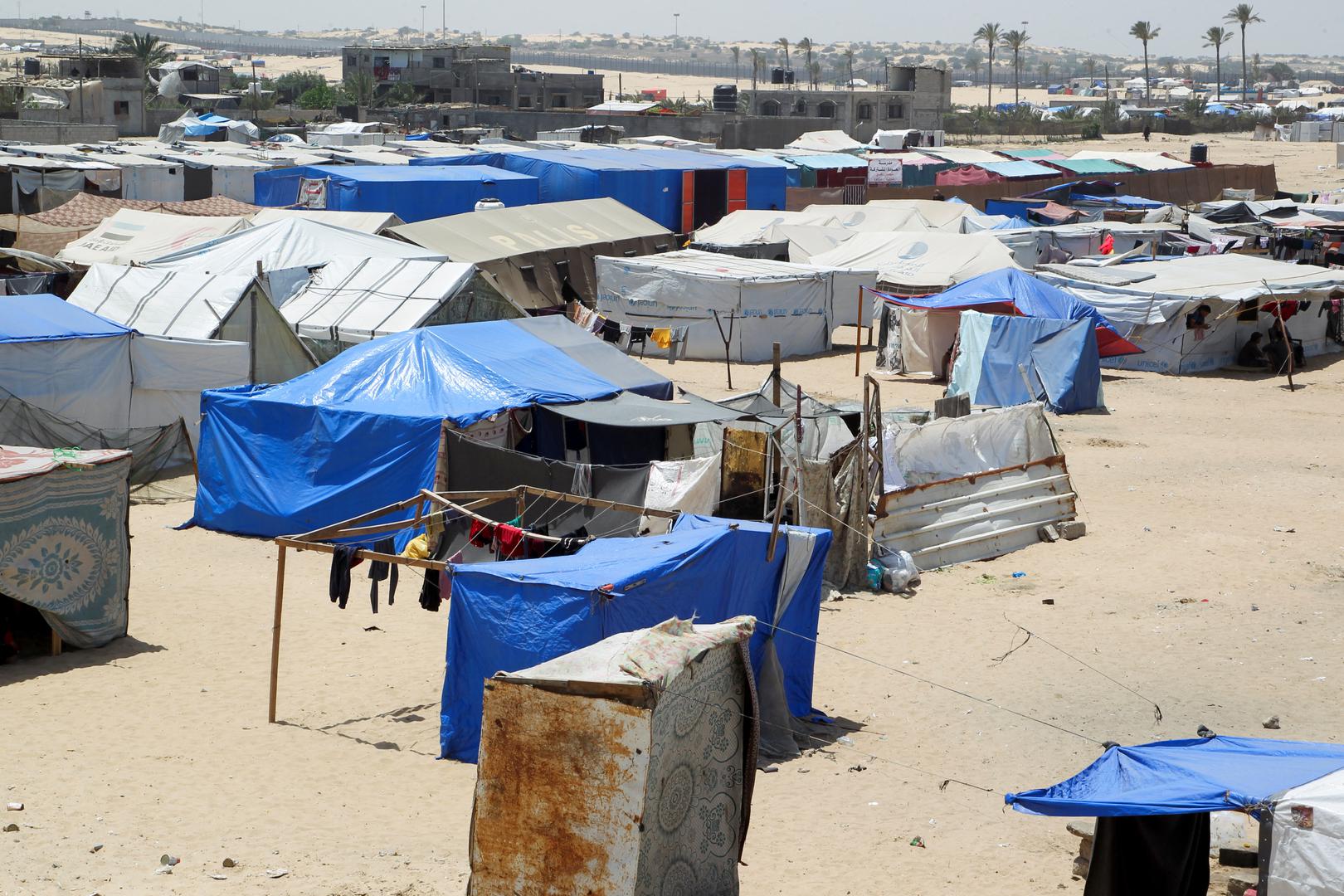 Displaced Palestinians, who fled their house due to Israeli strikes, shelter at a tent camp, amid the ongoing conflict between Israel and the Palestinian Islamist group Hamas, in the Al-Mawasi area in Rafah, in the southern Gaza Strip, May 22, 2024. REUTERS/Hatem Khaled Photo: HATEM KHALED/REUTERS