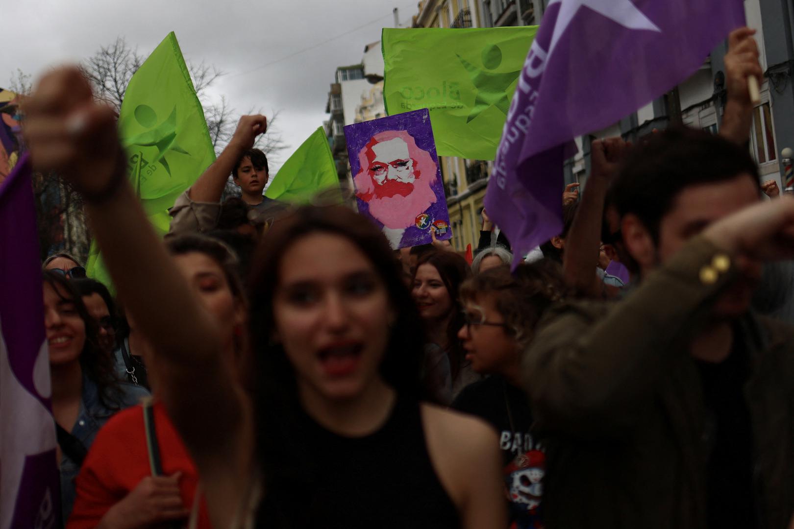 A placard is held as people shout slogans during a demonstration for the right to affordable housing in Lisbon, Portugal, April 1, 2023. REUTERS/Pedro Nunes Photo: PEDRO NUNES/REUTERS