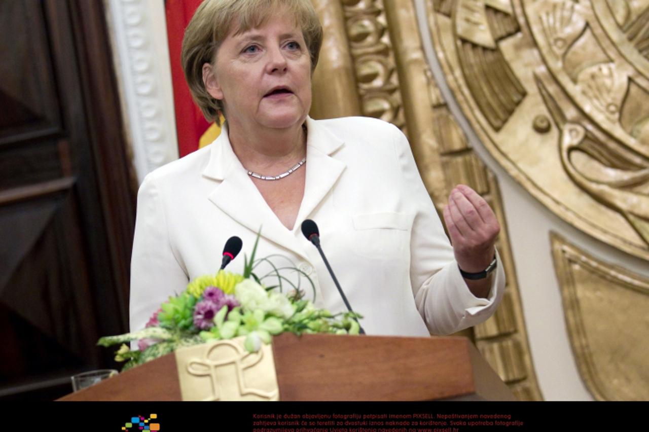 'Chancellor Angela Merkel speaks during a press conference in Hanoi, Vietnam, 11 October 2011. Among meeting Prime Minister Tan Dzung Merkel intends to visit economic companies and a temple during her