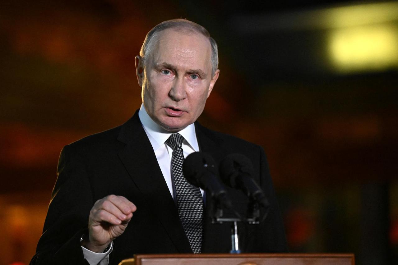 Russian President Putin attends a press conference in Beijing