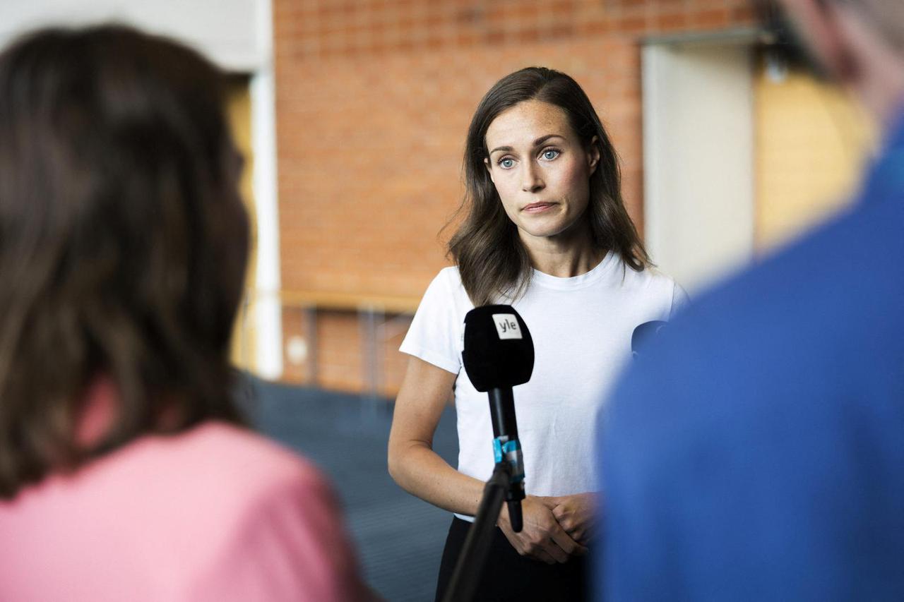 Finland's Prime Minister Sanna Marin speaks with members of the media in Kuopio