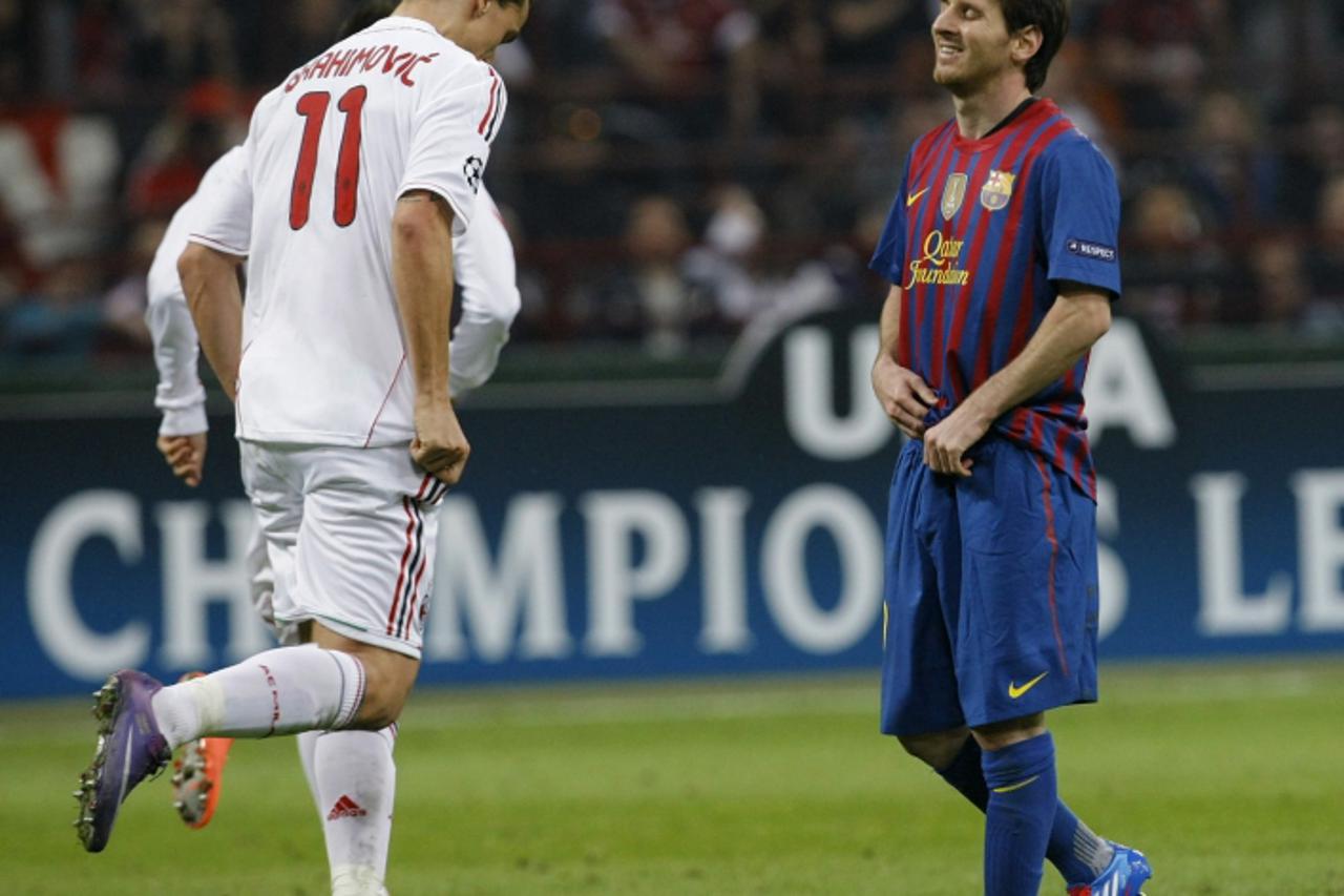 \'Barcelona\'s Lionel Messi (R) and AC Milan\'s Zlatan Ibrahimovic react during their UEFA Champions League quarter final first leg soccer match at the San Siro stadium in Milan March, 28 2012.    REU