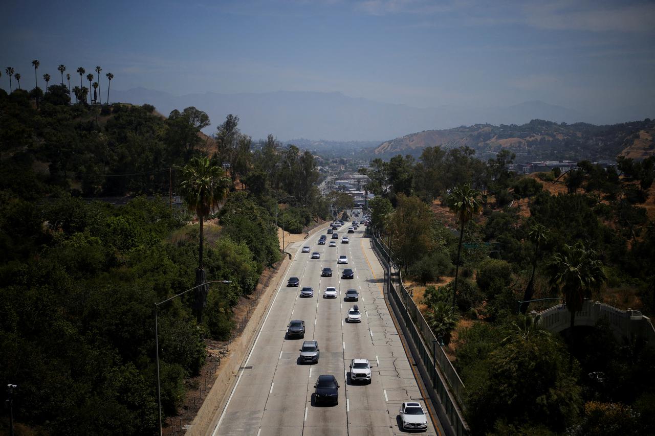 FILE PHOTO: FILE PHOTO: Cars drive along the 110 Freeway in Los Angeles