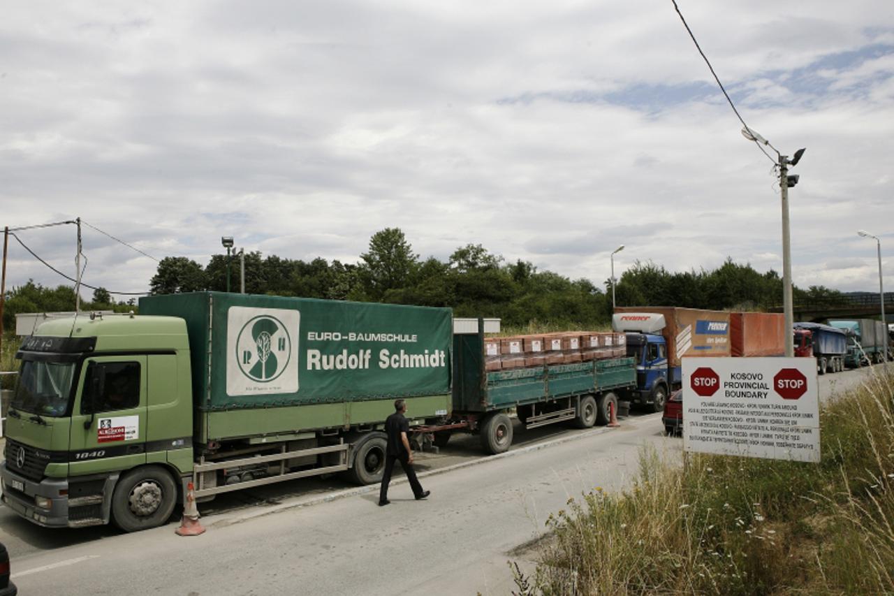 \'Trucks with goods from Serbia are stopped and turned back at the Merdare border crossing point between Kosovo and Serbia July 22, 2011. Kosovo has banned all imports from Serbia and introduced a 10 