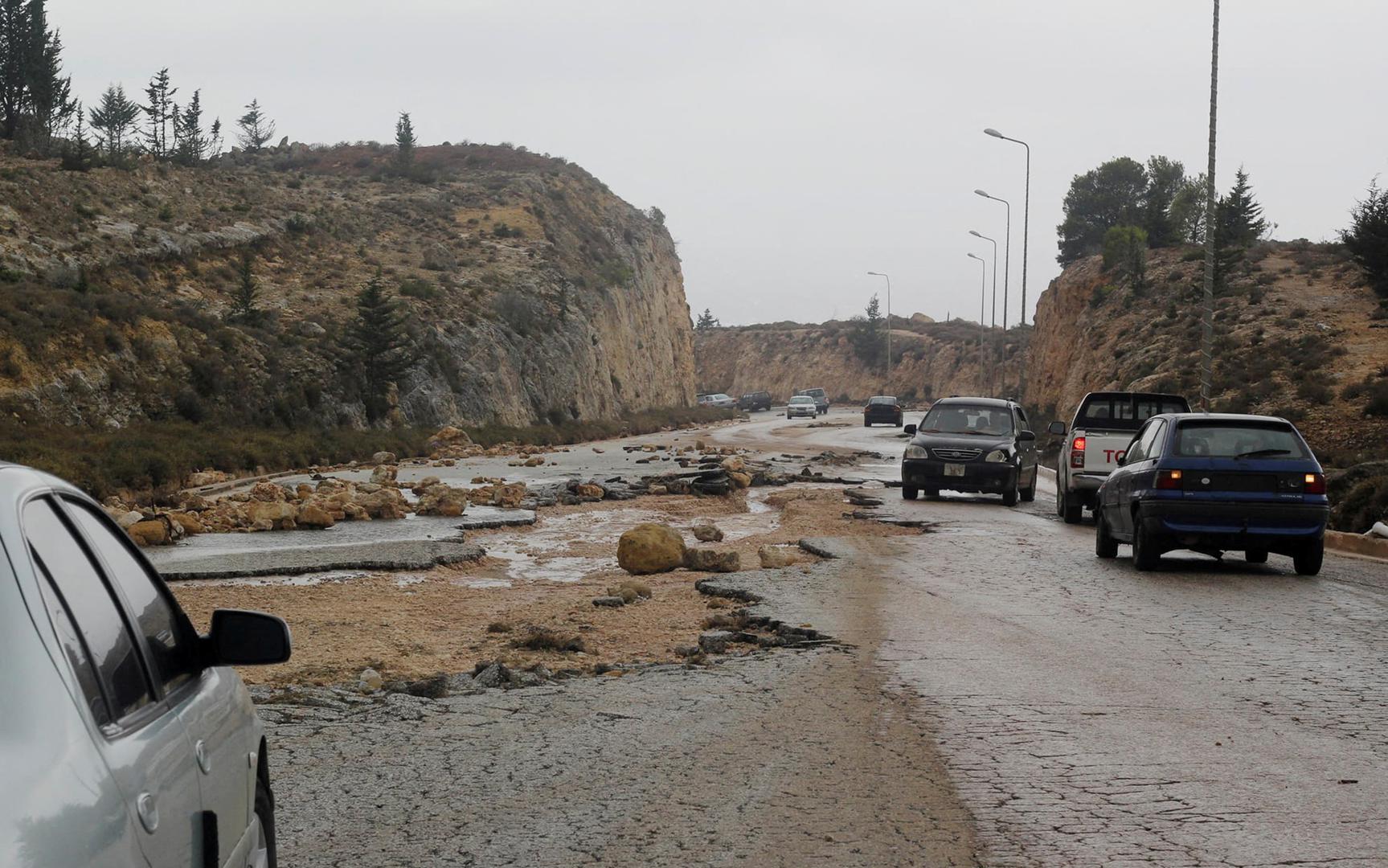 Cars are seen at a damaged road as a powerful storm and heavy rainfall flooded hit Shahhat city, Libya, September 11, 2023. REUTERS/Omar Jarhman NO RESALES. NO ARCHIVES. REFILE - REMOVING WATERMARK Photo: Stringer/REUTERS