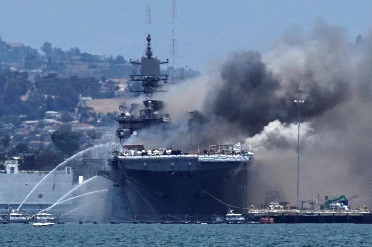 Smoke rises from a fire on board the U.S. Navy amphibious assault ship USS Bonhomme Richard at Naval Base San Diego