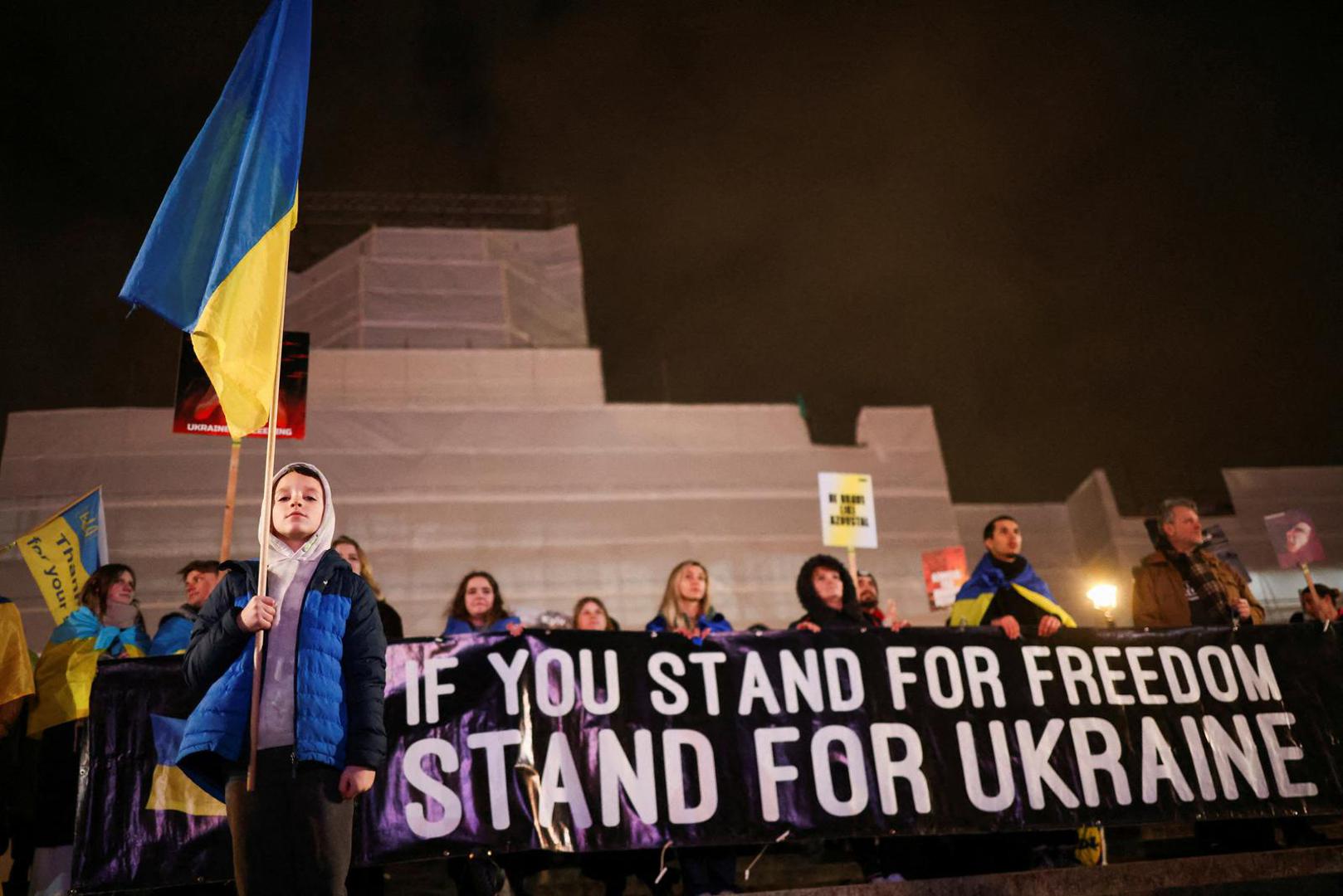 FILE PHOTO: A child holds a Ukrainian flag during a vigil for Ukraine held on the anniversary of the conflict with Russia, at Trafalgar Square in London, Britain February 23, 2023. REUTERS/Henry Nicholls/File Photo Photo: Henry Nicholls/REUTERS