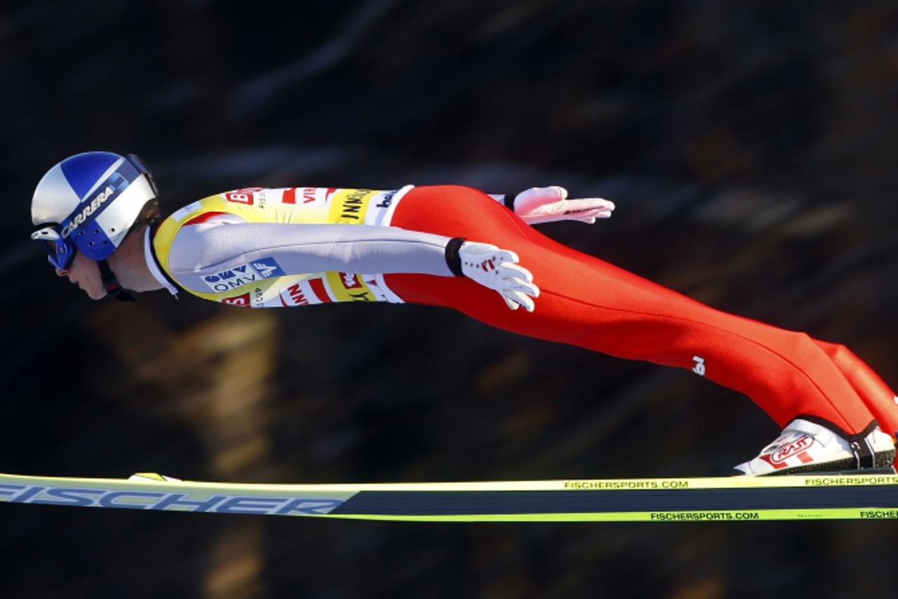 \'Austria\'s World Cup overall and tournament leader Thomas Morgenstern soars through the air during the practice jump for the third event of the four-hills ski jumping tournament in Innsbruck January