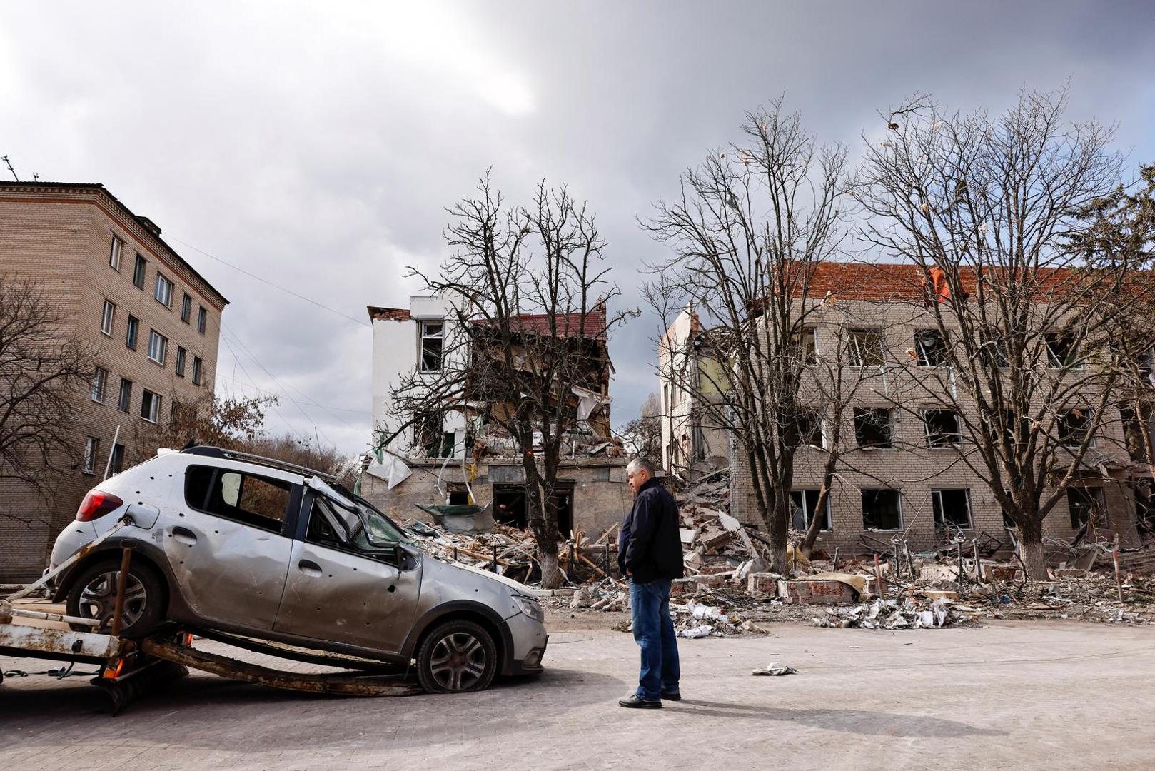 A man looks at a damaged vehicle in the aftermath of deadly shelling of an army office building, amid Russia's attack, in Sloviansk, Ukraine, March 27, 2023. REUTERS/Violeta Santos Moura Photo: VIOLETA SANTOS MOURA/REUTERS