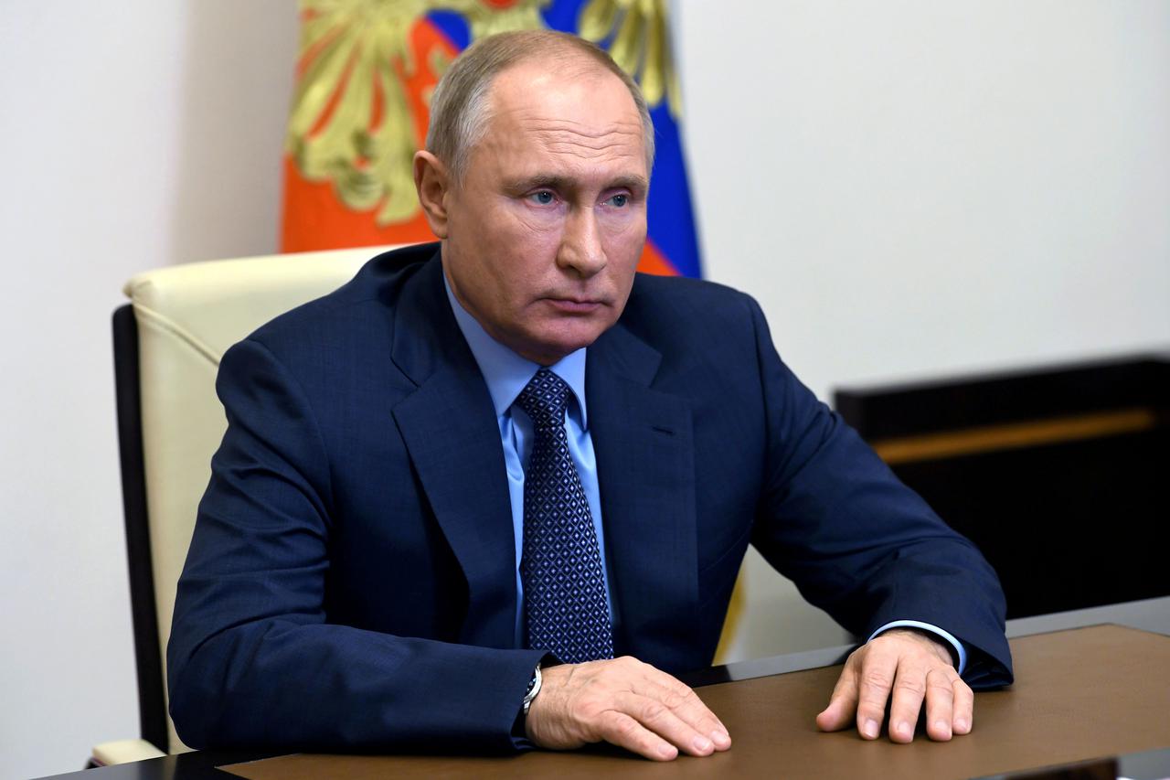 FILE PHOTO: Russian President Vladimir Putin takes part in a video conference at the Novo-Ogaryovo state residence outside Moscow