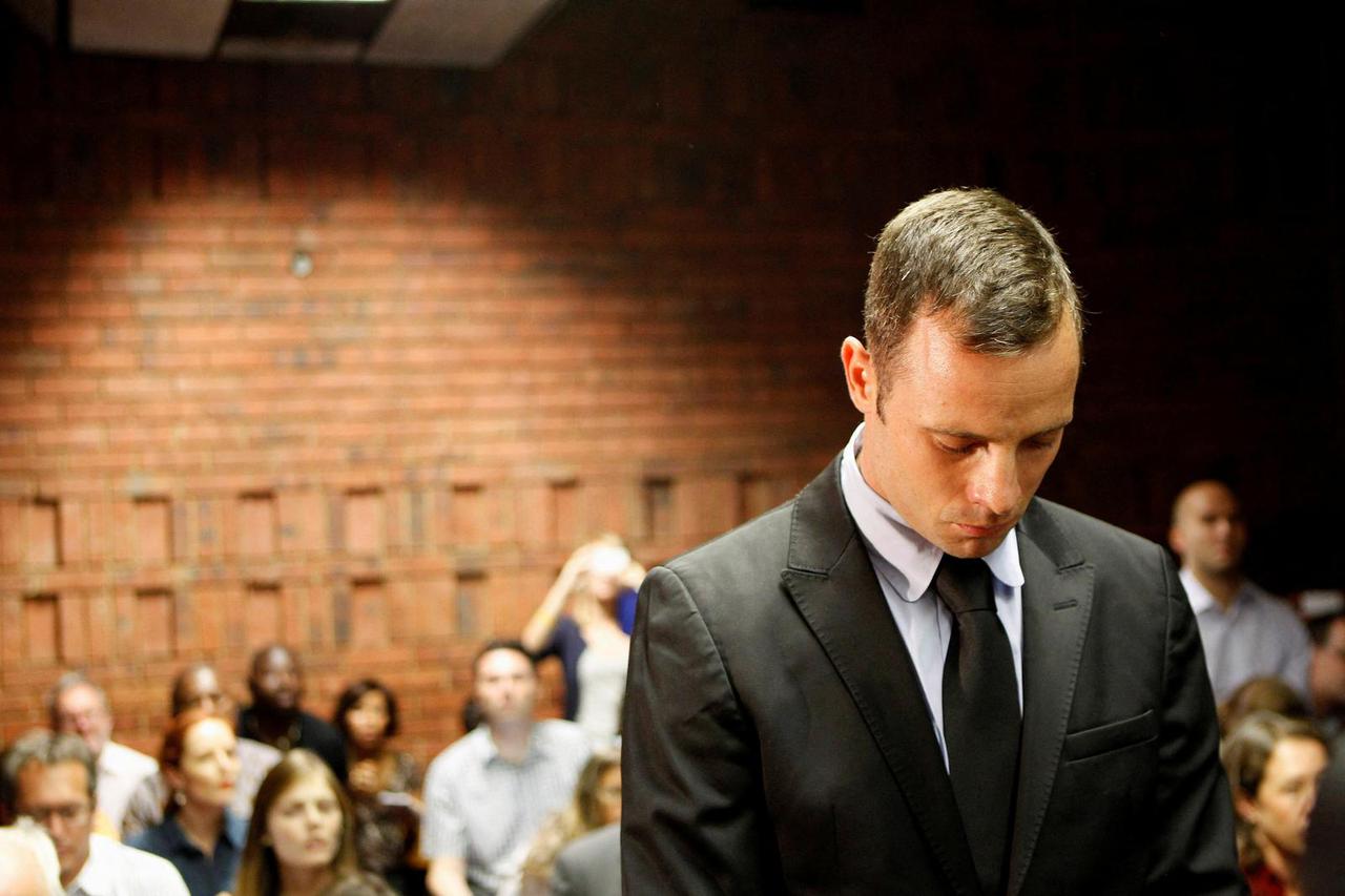 FILE PHOTO: Pistorius stands in the dock during a break in court proceedings at the Pretoria Magistrates court