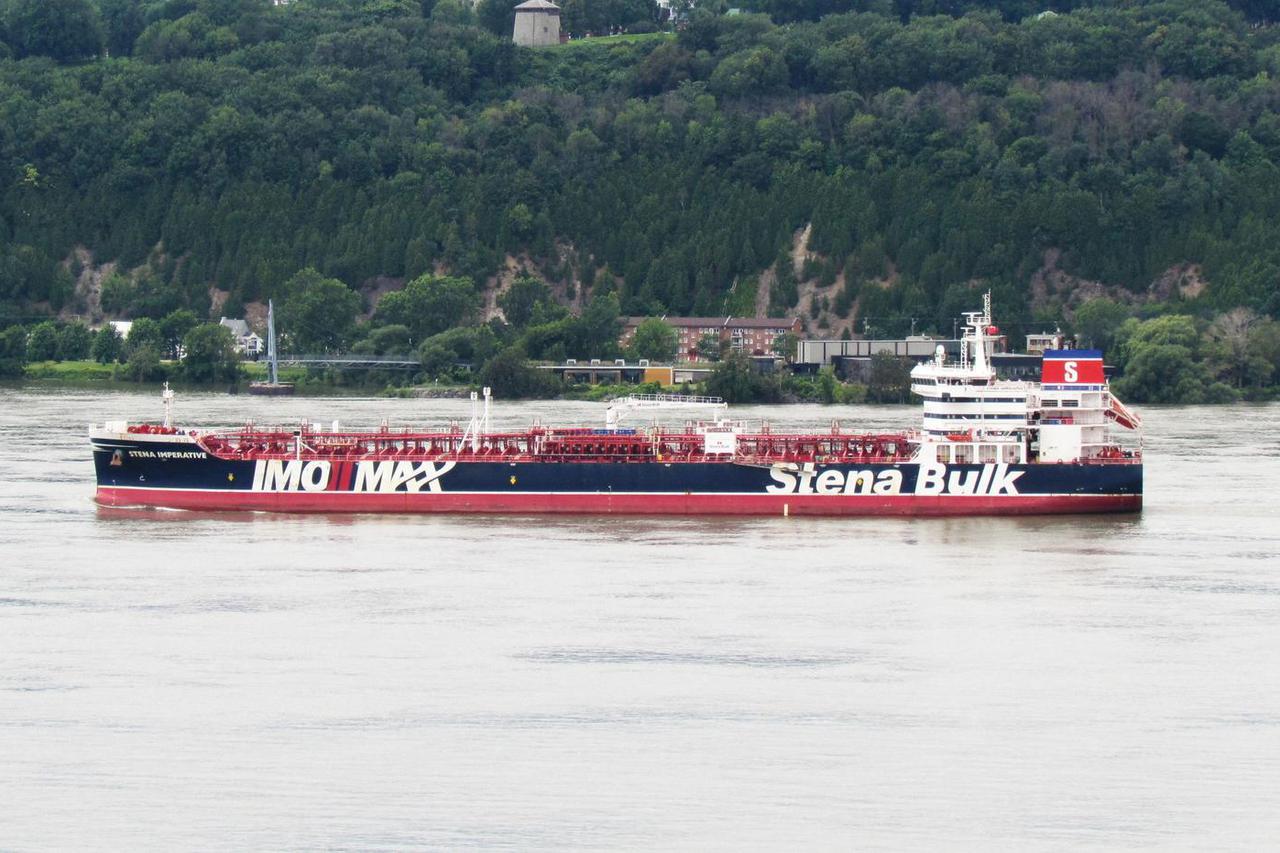 File pictures of U.S.-flagged tanker approached by Iranian boats in Strait of Hormuz