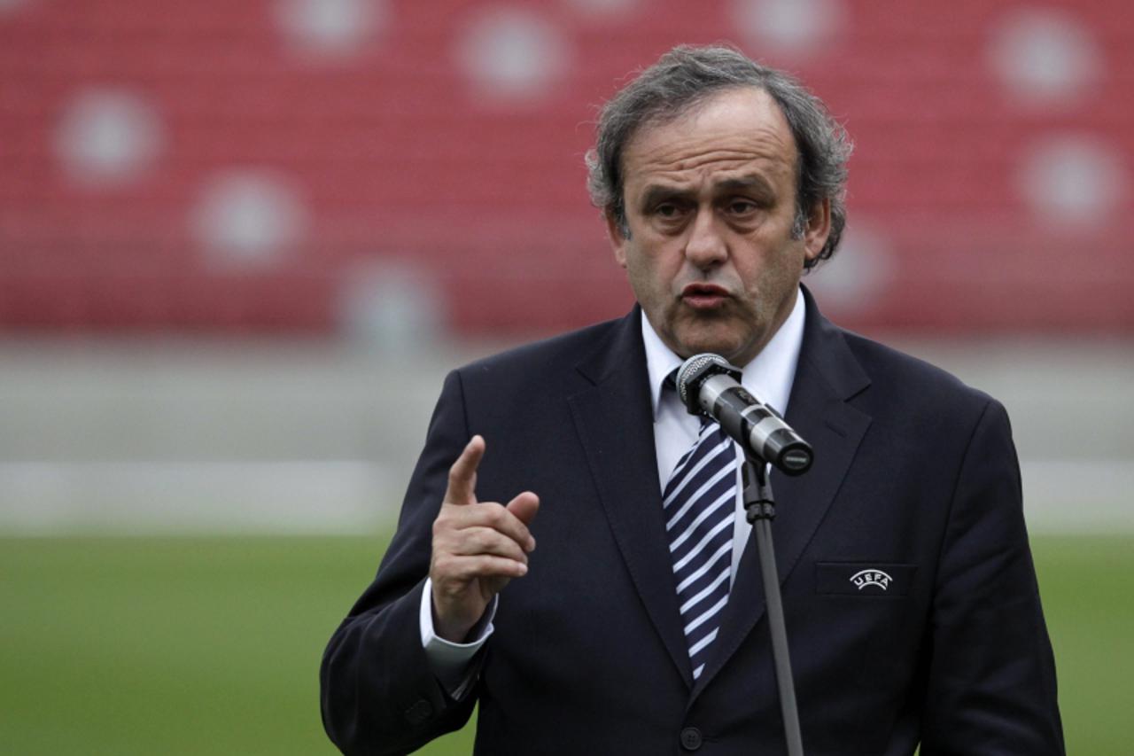 'UEFA President Michel Platini speaks during a news conference about preparations for the EURO 2012 soccer championships at the National Stadium in Warsaw April 12, 2012. REUTERS/Kacper Pempel (POLAND