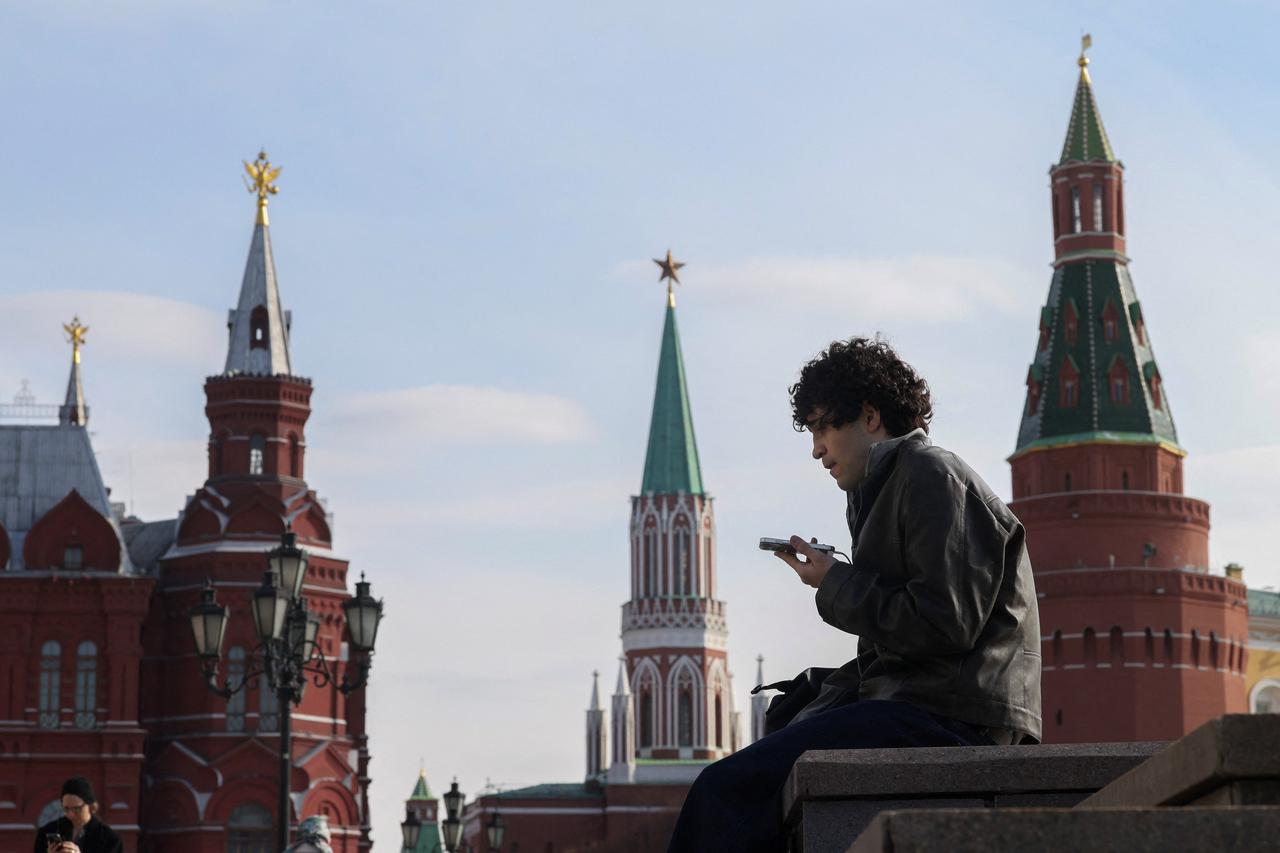 A man checks his mobile phone in central Moscow