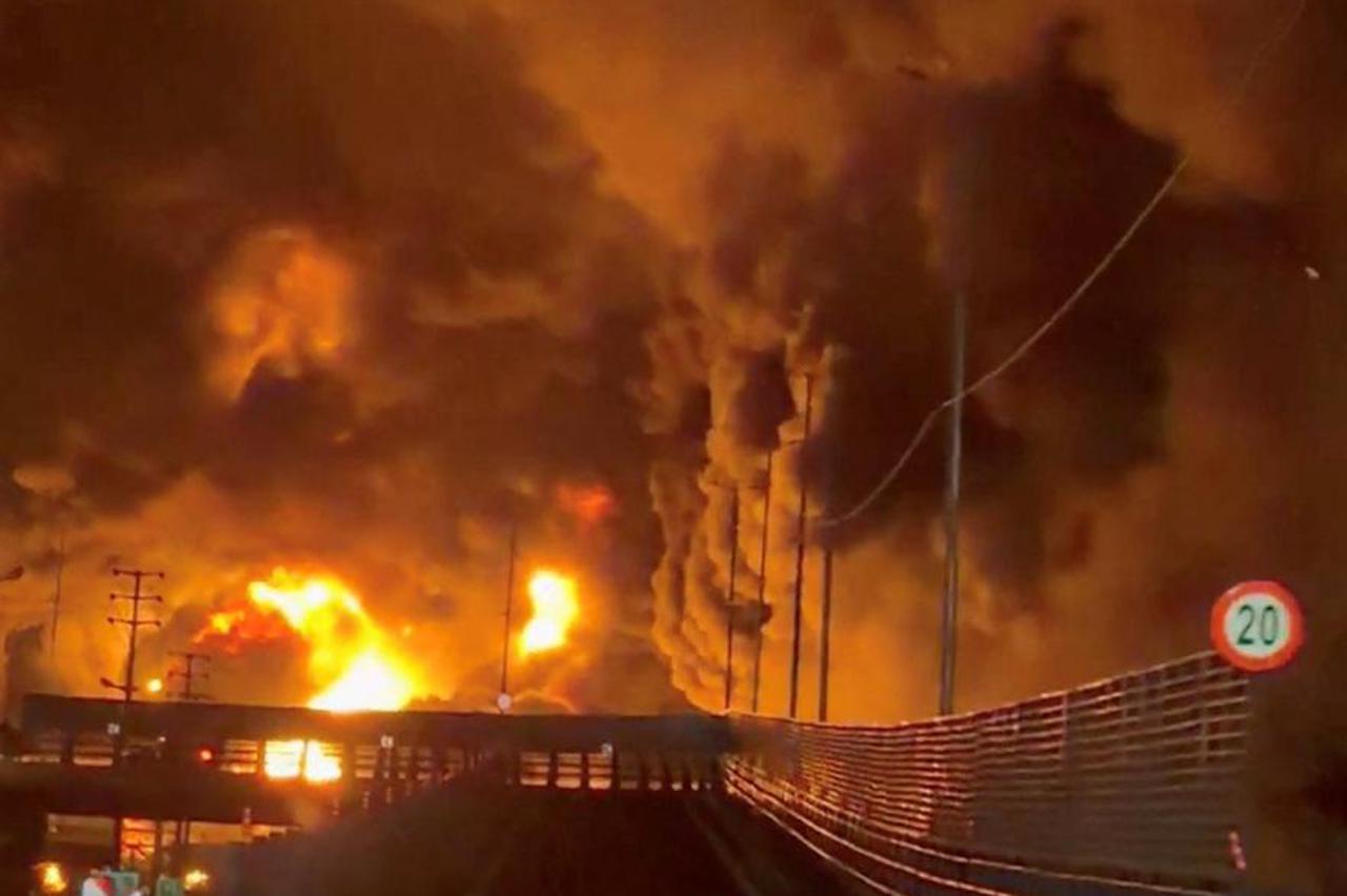 Fire burns and smoke rises from Aqdasiyeh Oil Depot in Tehran